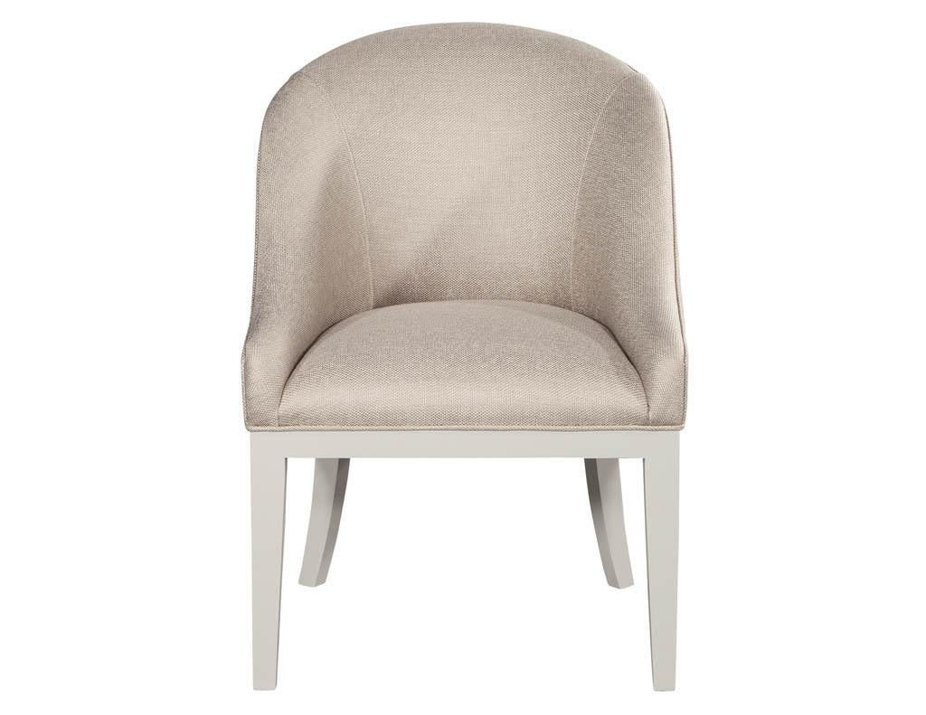 Set of 10 custom Westmore modern dining chairs in beige and white. Carrocel custom designed tub dining chair. Finished in a Chantilly Lace lacquer and upholstered in a designer textured fabric. Available in set of 10.

Price includes complimentary