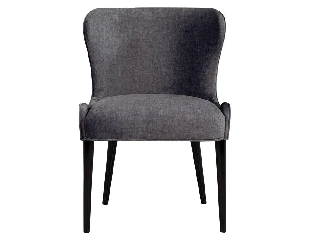 Set of 10 custom modern dining chairs in dark indigo velvet by Carrocel. Sleek sculpted curves upholstered in a dark indigo velvet.
Price includes complimentary curb side delivery to the continental USA.