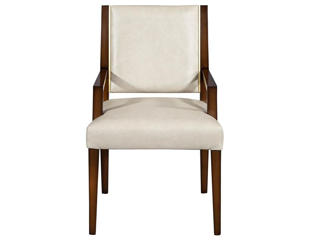 Set of 10 custom modern leather dining chairs with brass. Carrocel custom Nevio dining chair. Featuring clean modern lines, Mid-Century Modern inspired design with inlay brass detail. Handcrafted here in Toronto, Canada by our master craftsmen.