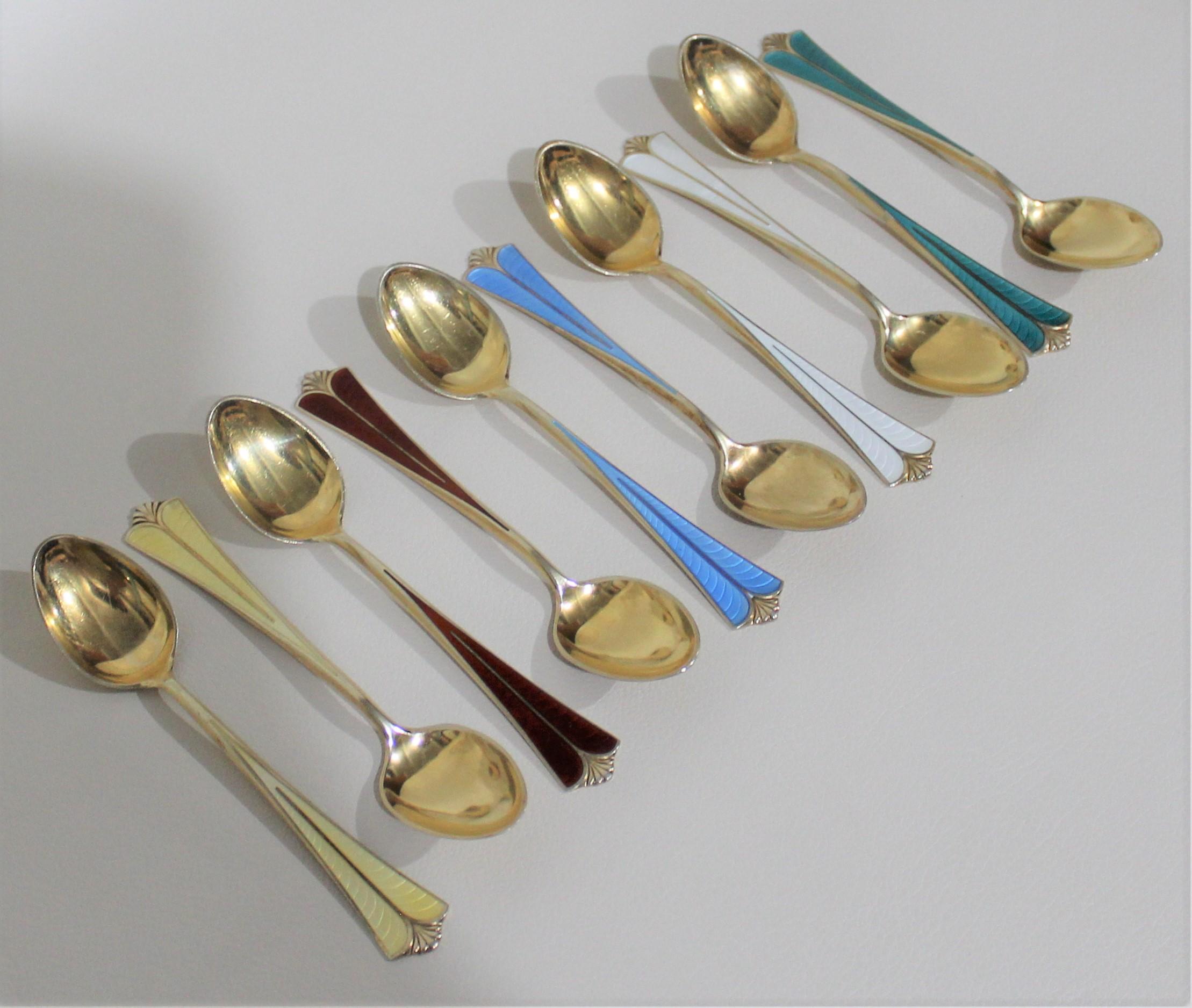 This is a beautiful set of Norwegian sterling silver spoons by David Andersen. This collection includes ten spoons with enamel inlays and are finished with a gold wash. Each piece is stamped with David-Andersen hallmarks along with “Norway –