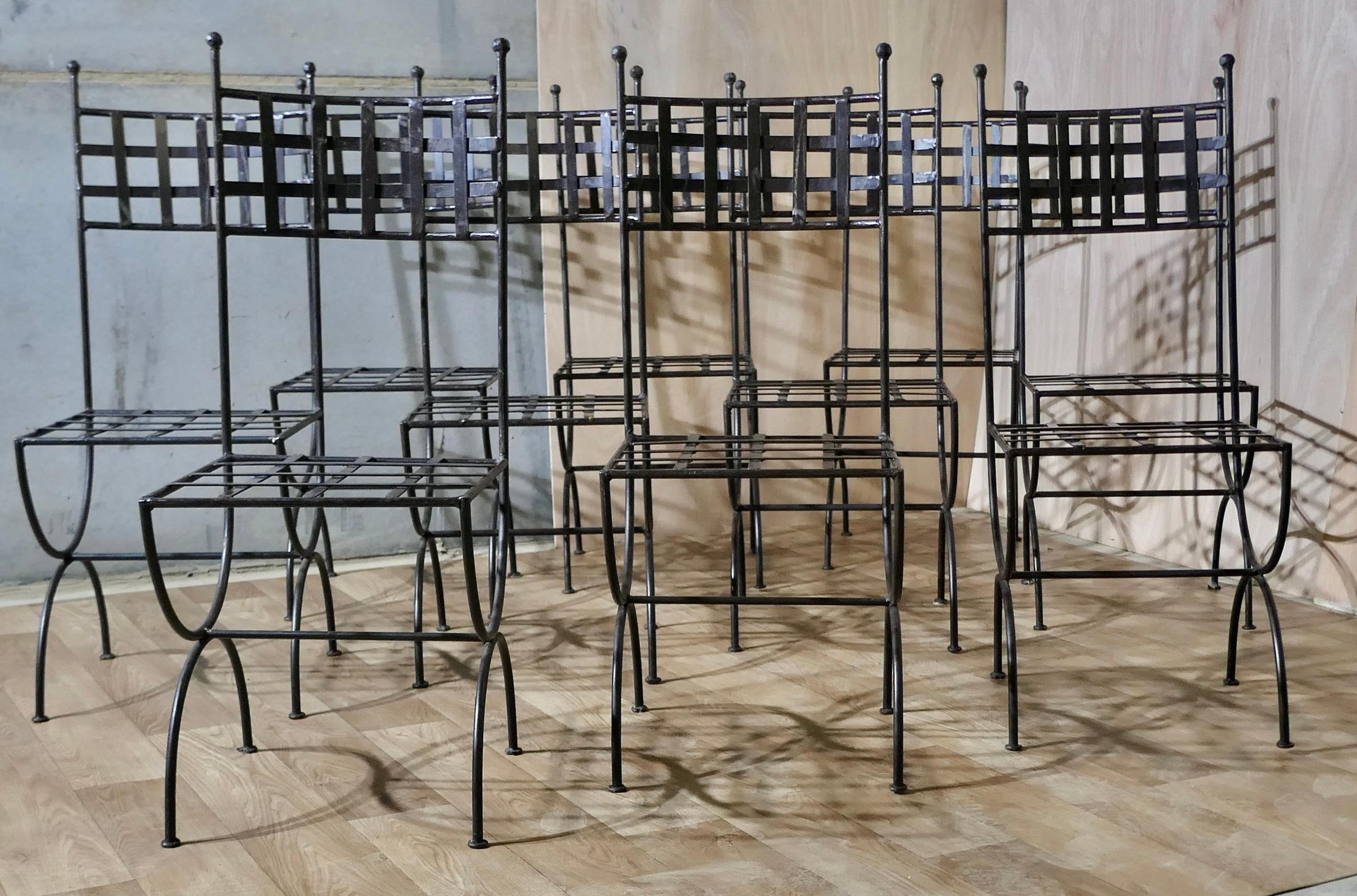 Set of 10 Designer High Back Strap-work Iron Patio Chairs

The Chairs have tall latticed back rests and a woven strap seat, suitable for a very modern interior or possibly a very stylish garden
These are very strong sturdy and heavy pieces in great