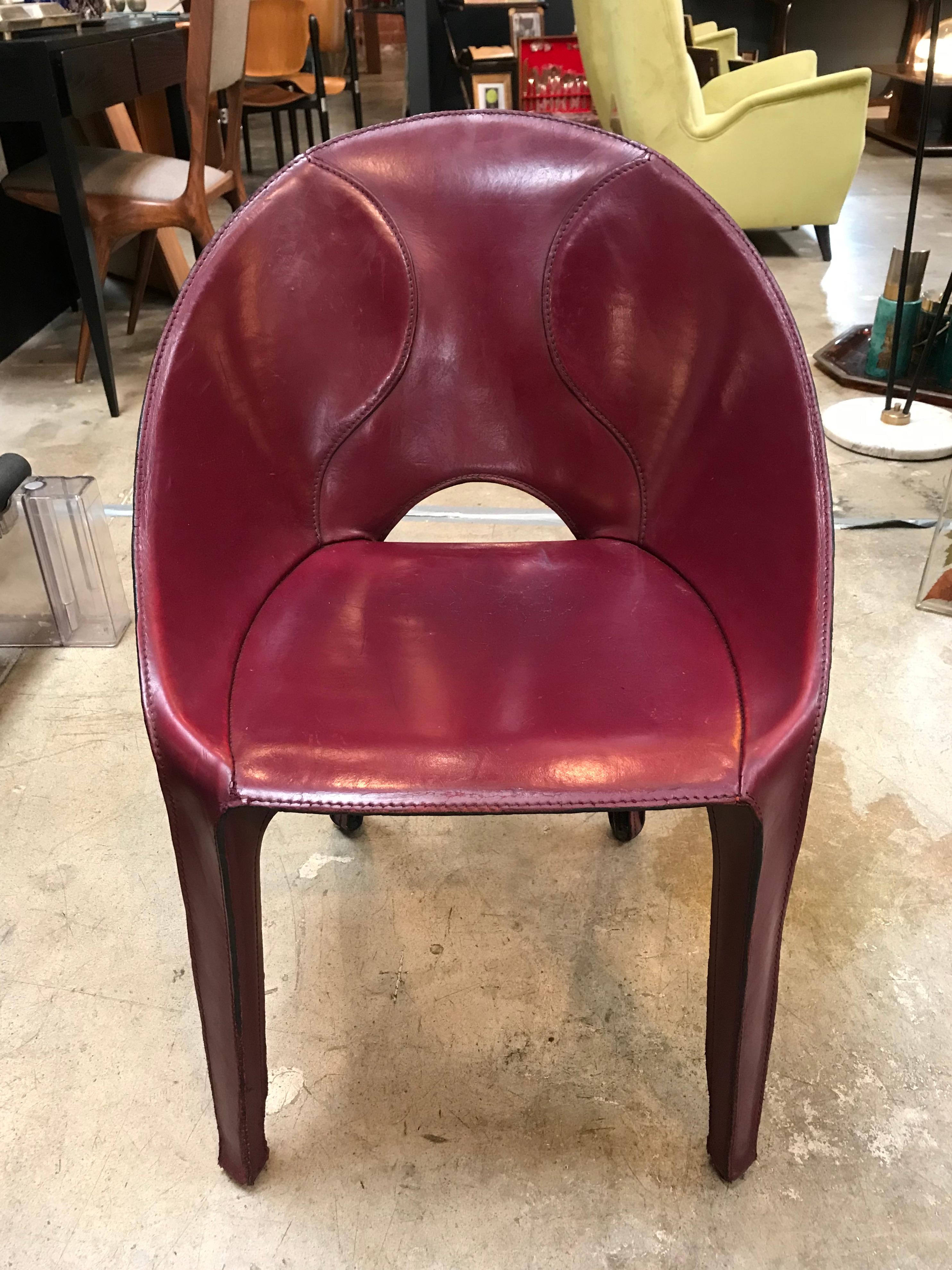 Stunning set of 10 burgundy leather chairs for Cassina studio, 1970s, Italy.
The chair is very comfortable and unique.
Signed CASSINA on the bottom 

Each chair can be sold individually, $ 1,600/each.
 