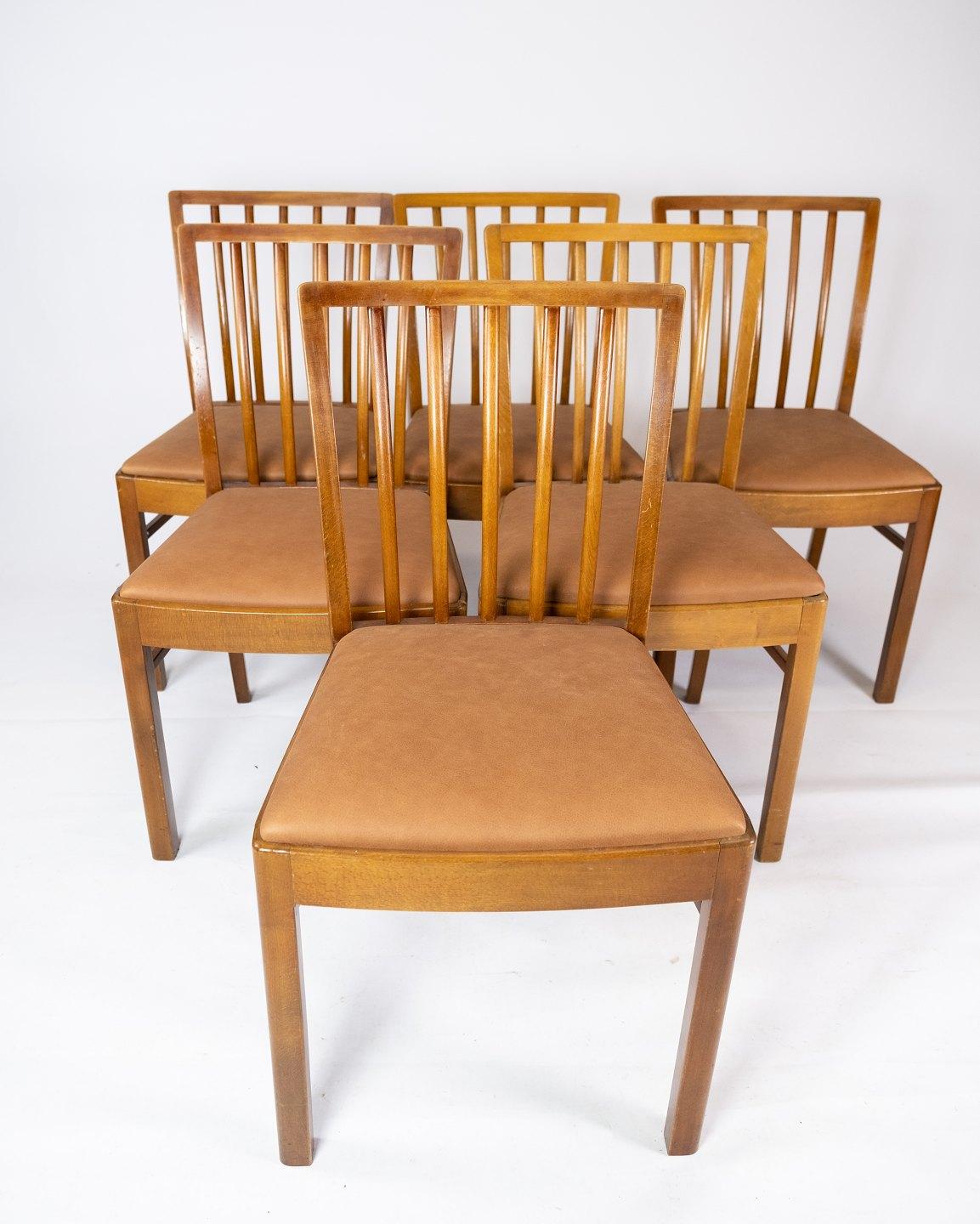 Danish Art Deco Set of 10 Dining Room Chairs of Light Wood and Cognac Leather, 1940s For Sale