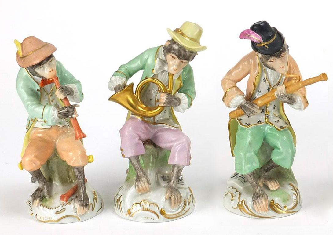 Set of 10 rococo-style monkey musicians in Dresden porcelain with lovely gold highlights. 
Each one is playing a different instrument, the whole ensemble forming a beautiful orchestra of colorful musicians. 
They are largely inspired by the