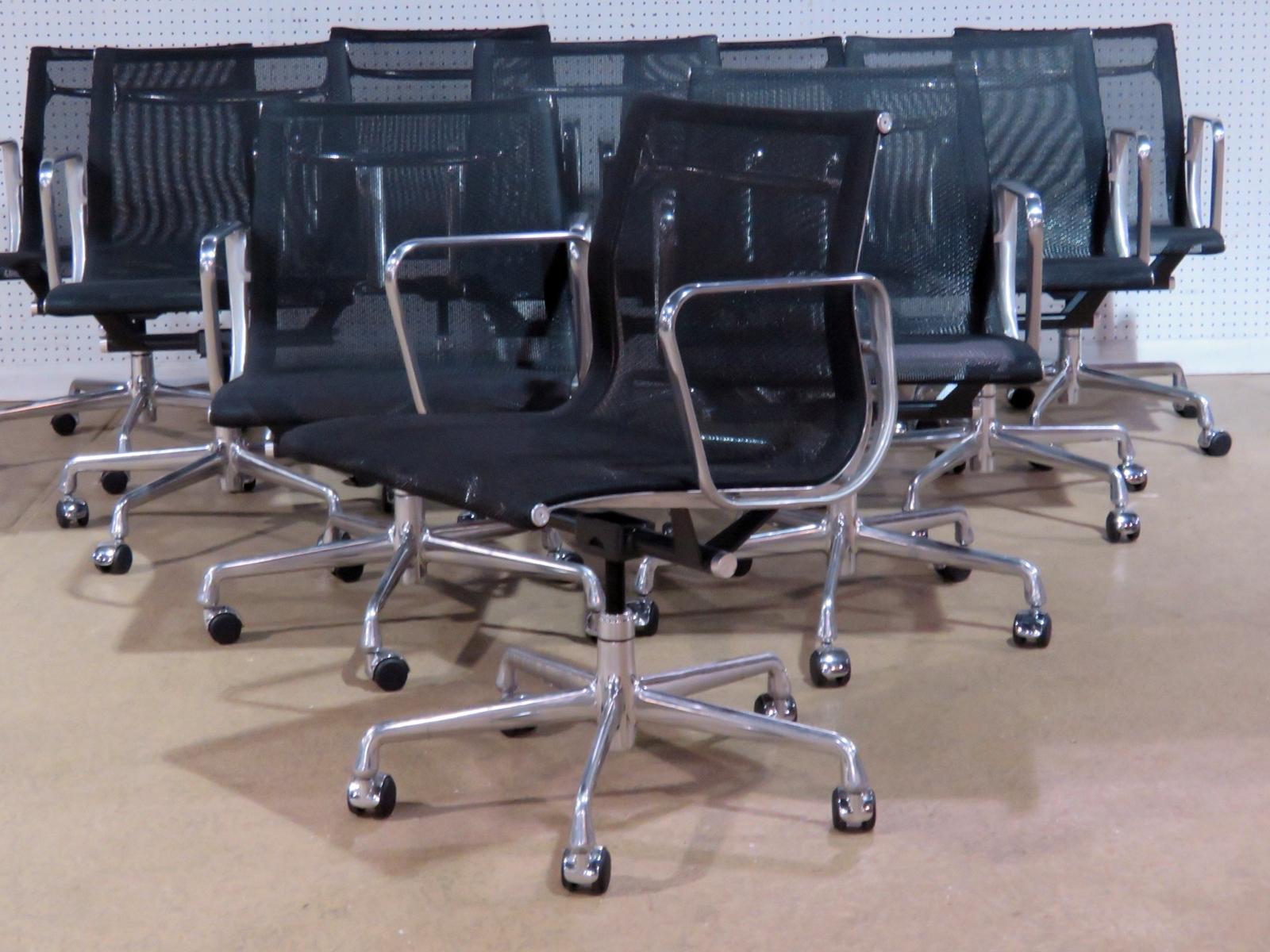 Set of 10 adjustable swivel Eames for Herman Miller office chairs on casters.