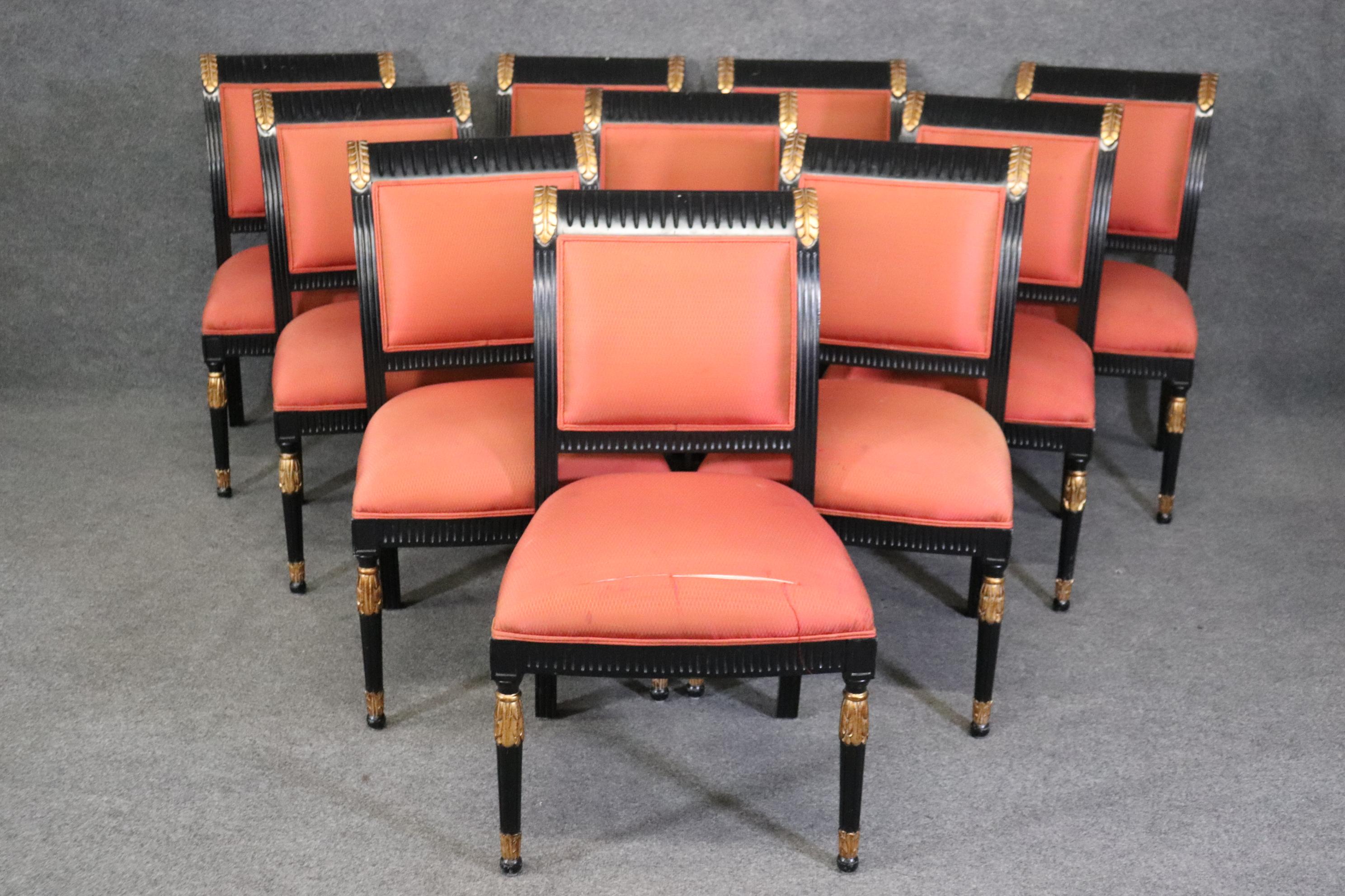 This is a gorgeous set of 10 French Directoire style sidechairs in black lacquer and gold from the 1960s era. The chairs are in good condition as far as their frames are concerned but will need reupholstery. They measure 36.75 tall x 22 wide x 24.75