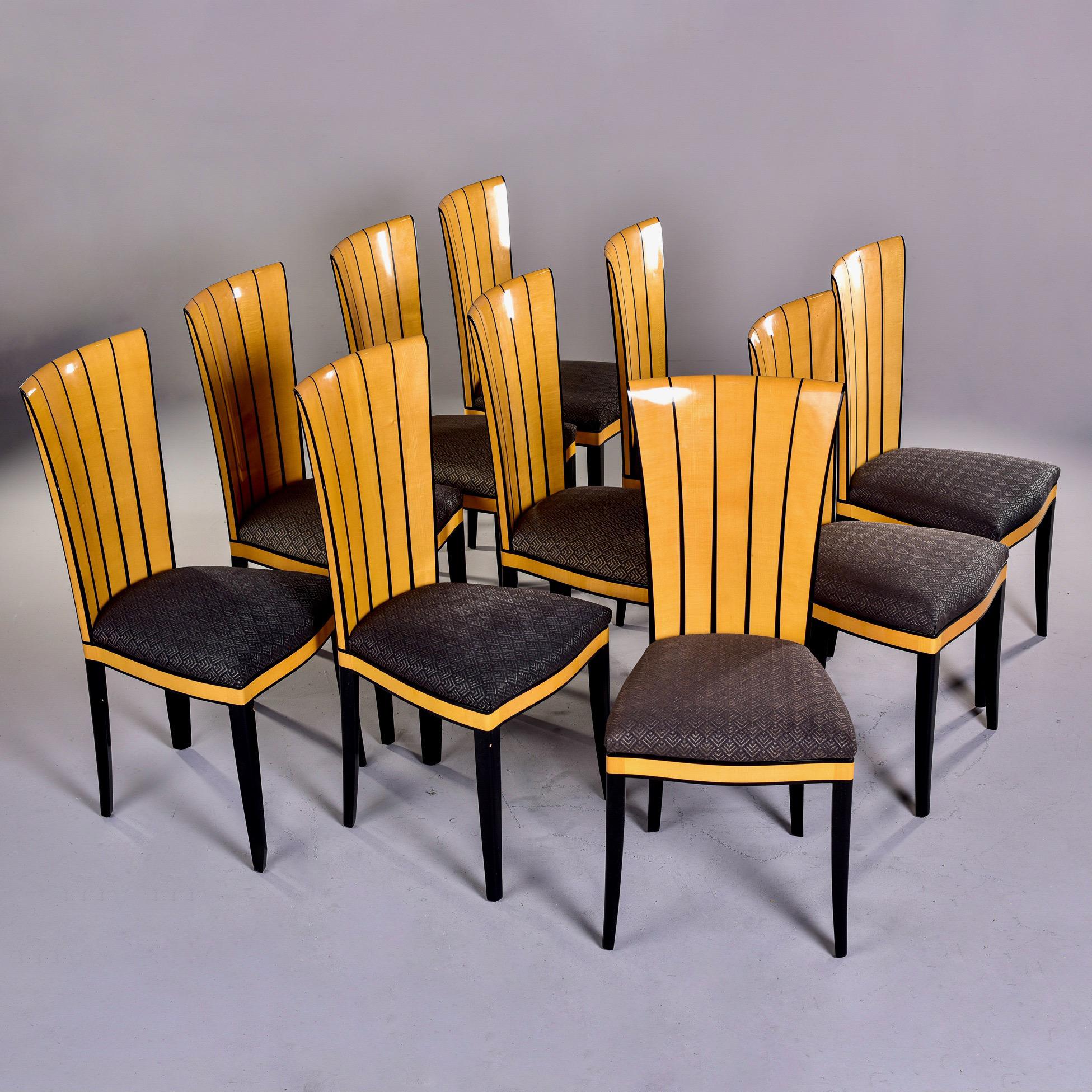 Set of ten circa 1990 dining chairs designed by Eliel Saarinen for his Cranbrook estate in 1929. Licensed for production by various manufacturers since the 1970s, these particular chairs were made by Charles Phipps & Sons. The chairs are made of