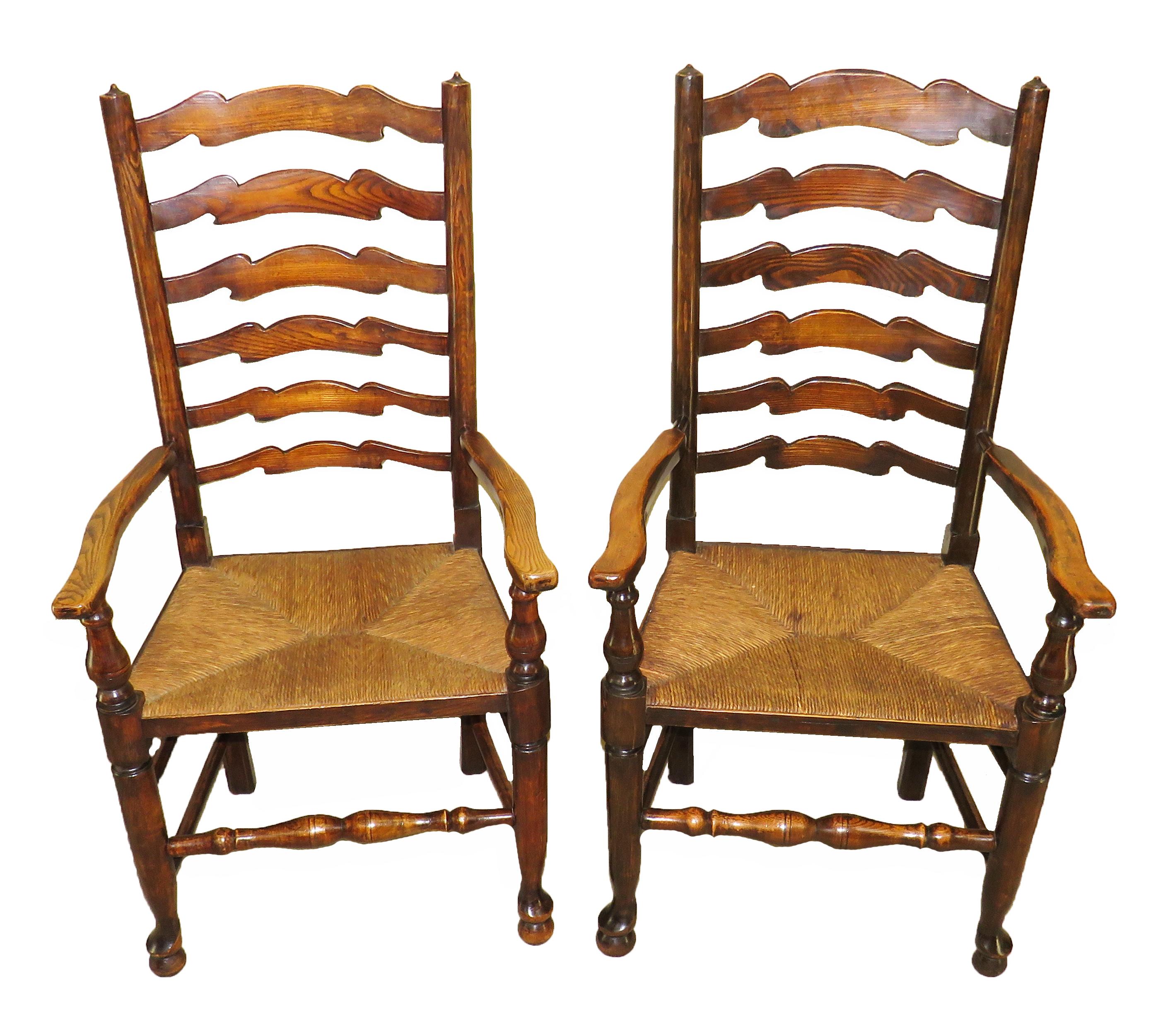 A delightful set of 10 matched English late 19th century ash
and elm ladder back country dining chairs consisting of
8 single chairs and 2 armchairs having elegant wavy
ladderbacks over rushed seats raised on turned legs
and stretchers

(These