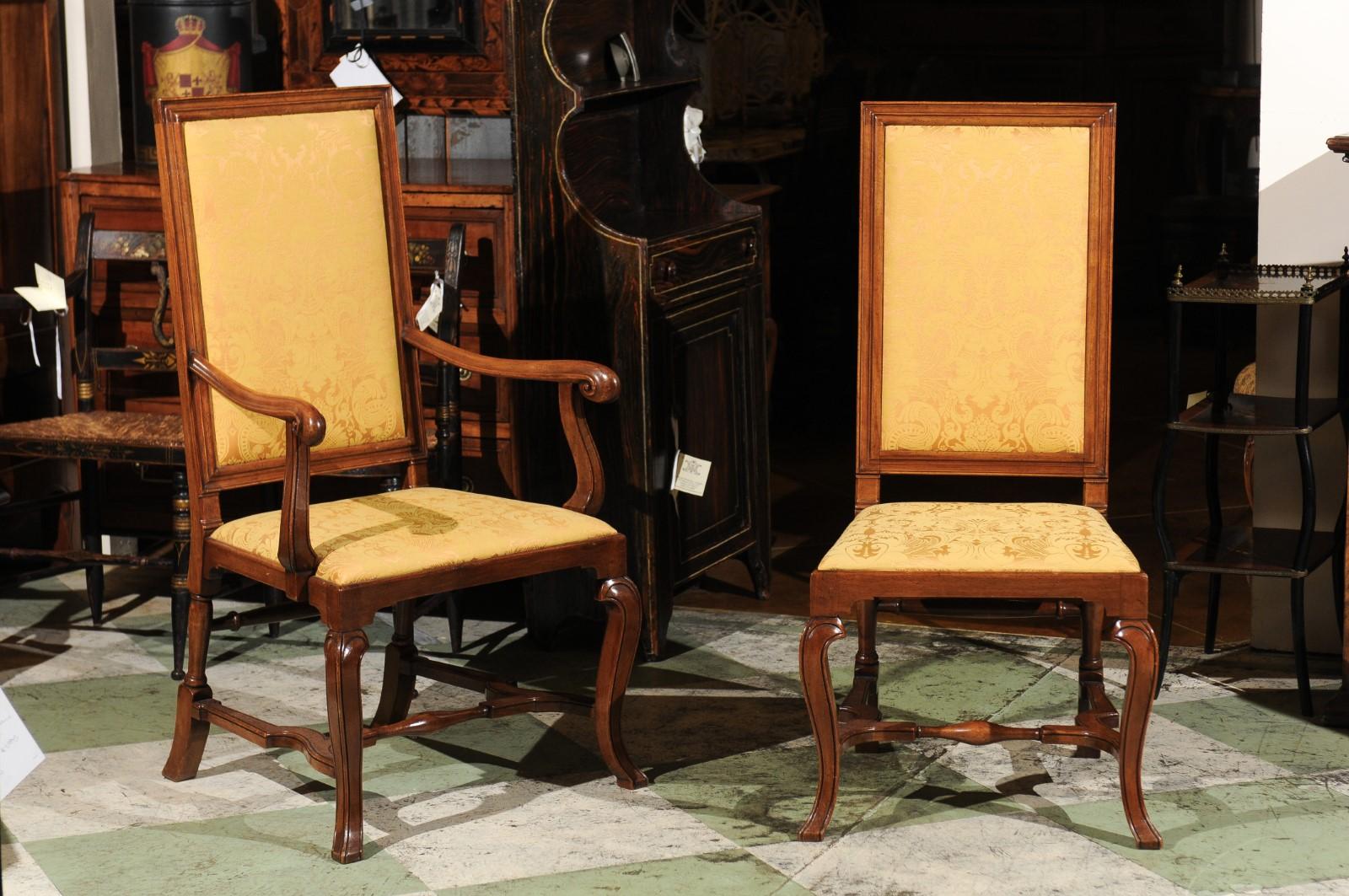 The set of 10 English Queen Anne Style walnut dining chairs with tall upholstered backs, cross stretchers and cabriole legs. 2 of the chairs are early 18th century and 8 are late mid - late 20th century. 

