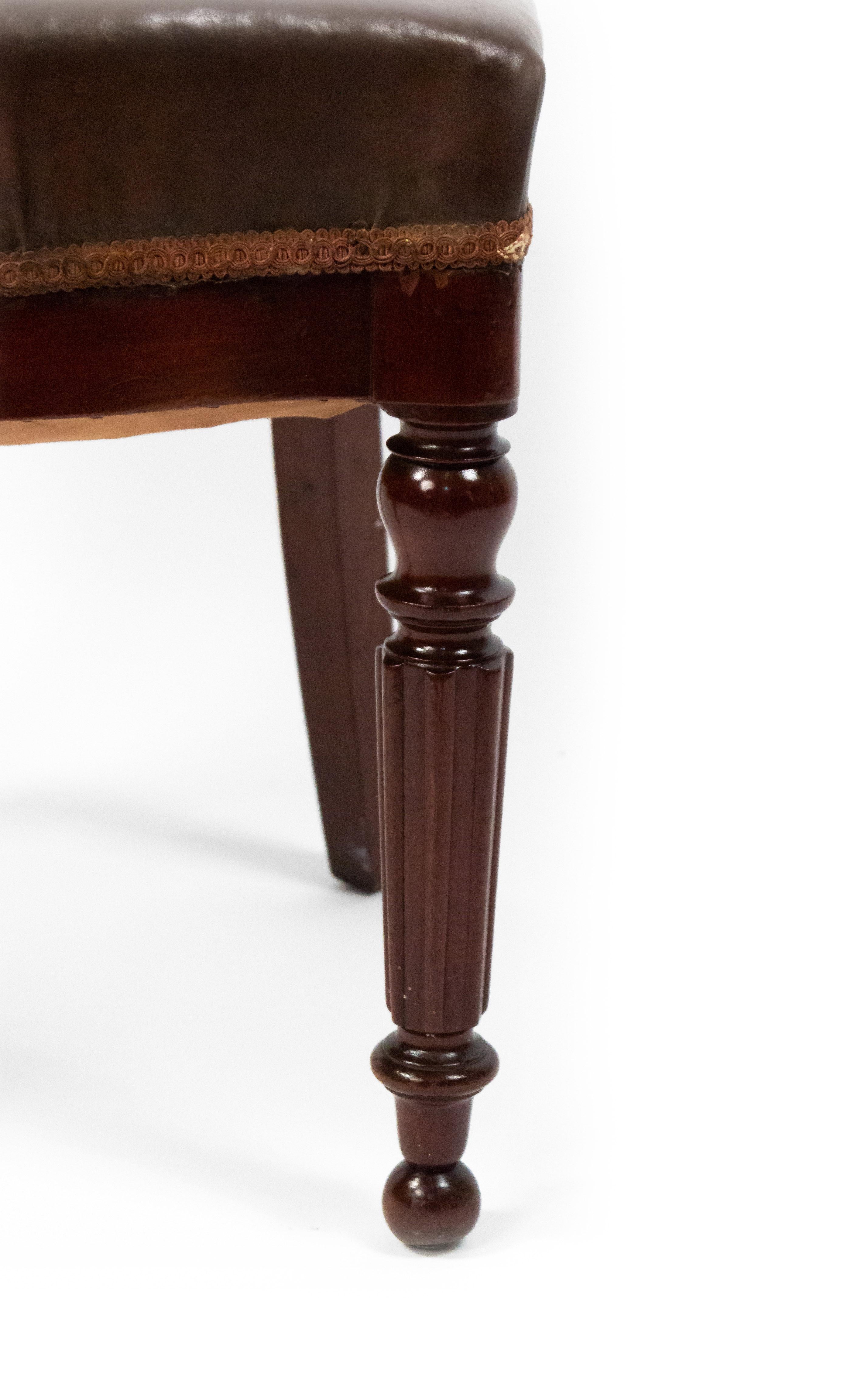 Set of 10 English Victorian (late 19th century) mahogany side / dining chairs with shaped open backs, leather seats, and fluted front legs.
 