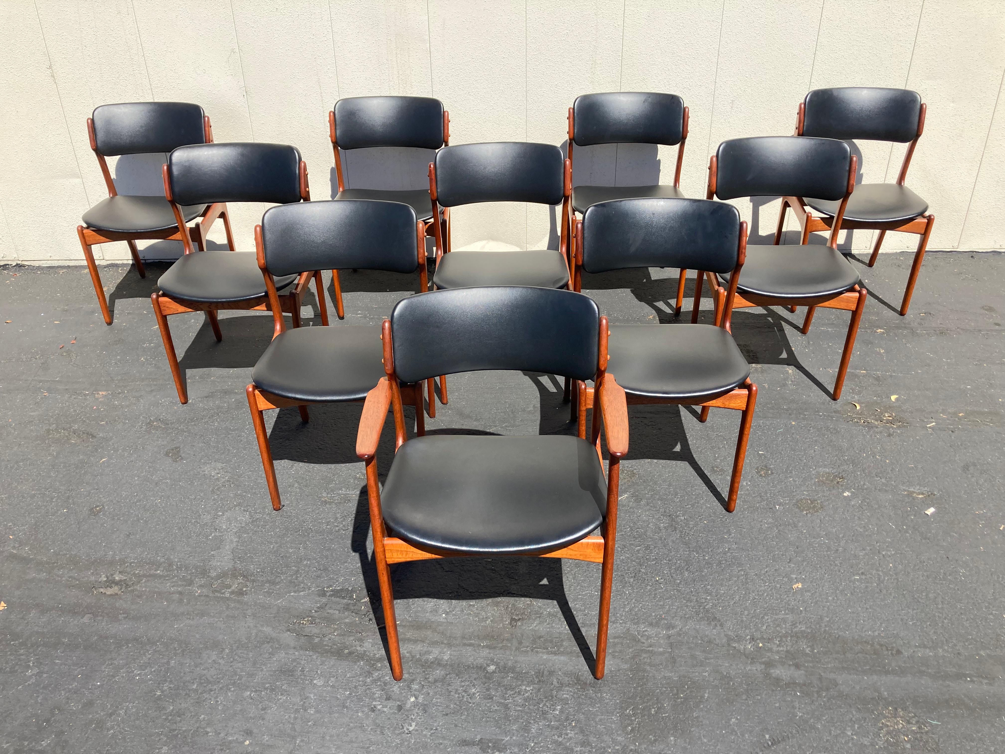 Set of 10 Danish mid century modern dining chairs designed by Erik Buch and made by Oddense Maskinsnedkeri in Denmark.  Classic Scandinavian design with sculpted details that is striking from all angles.  Molded floating seats and curved backs are