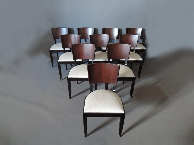 A set of 10 fine French Art Deco dining chairs with a palissander front back and an ebonized beech base.