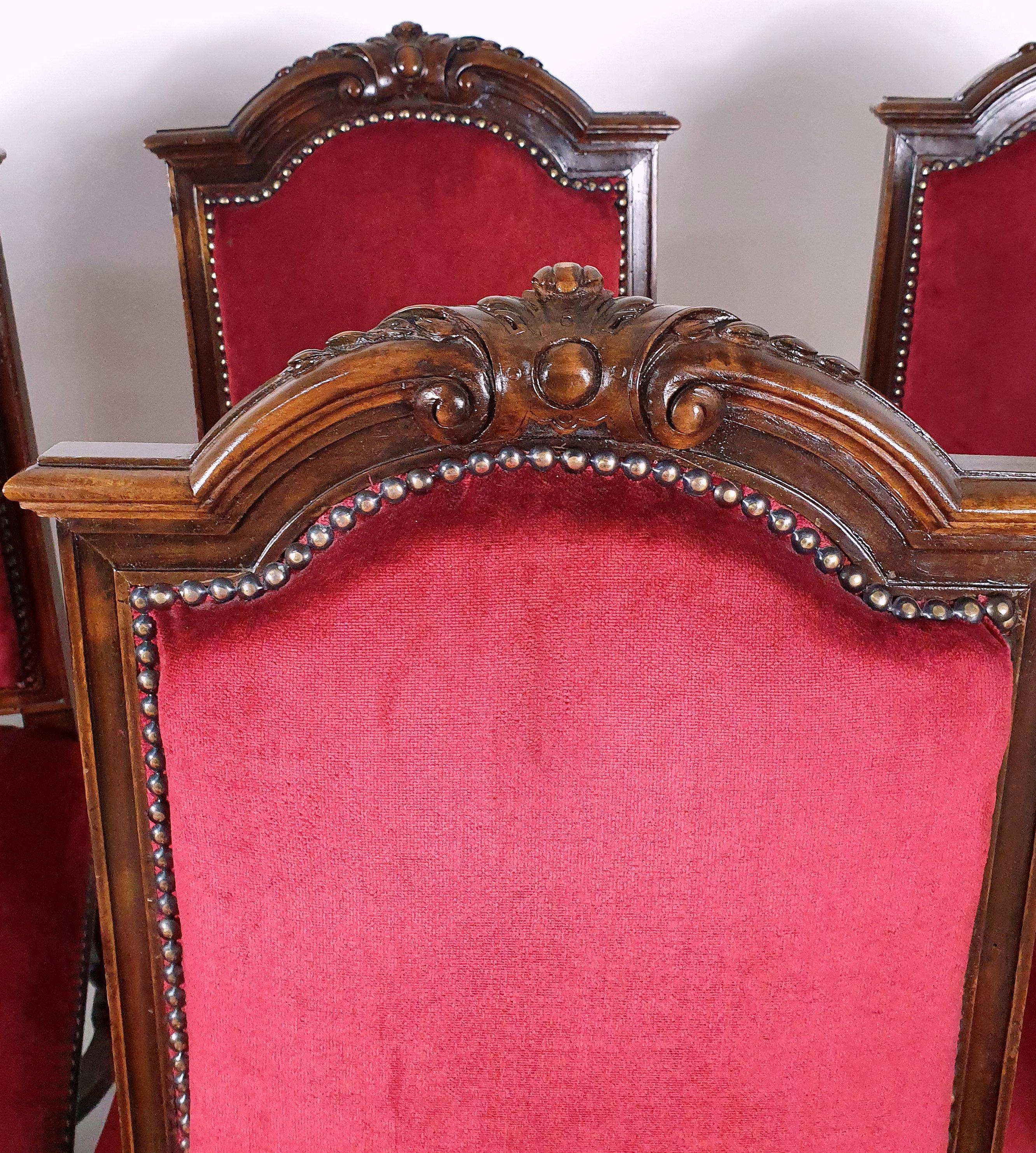 This beautiful and striking set of 10 French dining chairs are upholstered in rich red velvet, with metal stud detail and are supported on octagonal formed legs united by shaped cross stretchers. Each chair measures 18 in – 45.7 cm wide, 21 in –