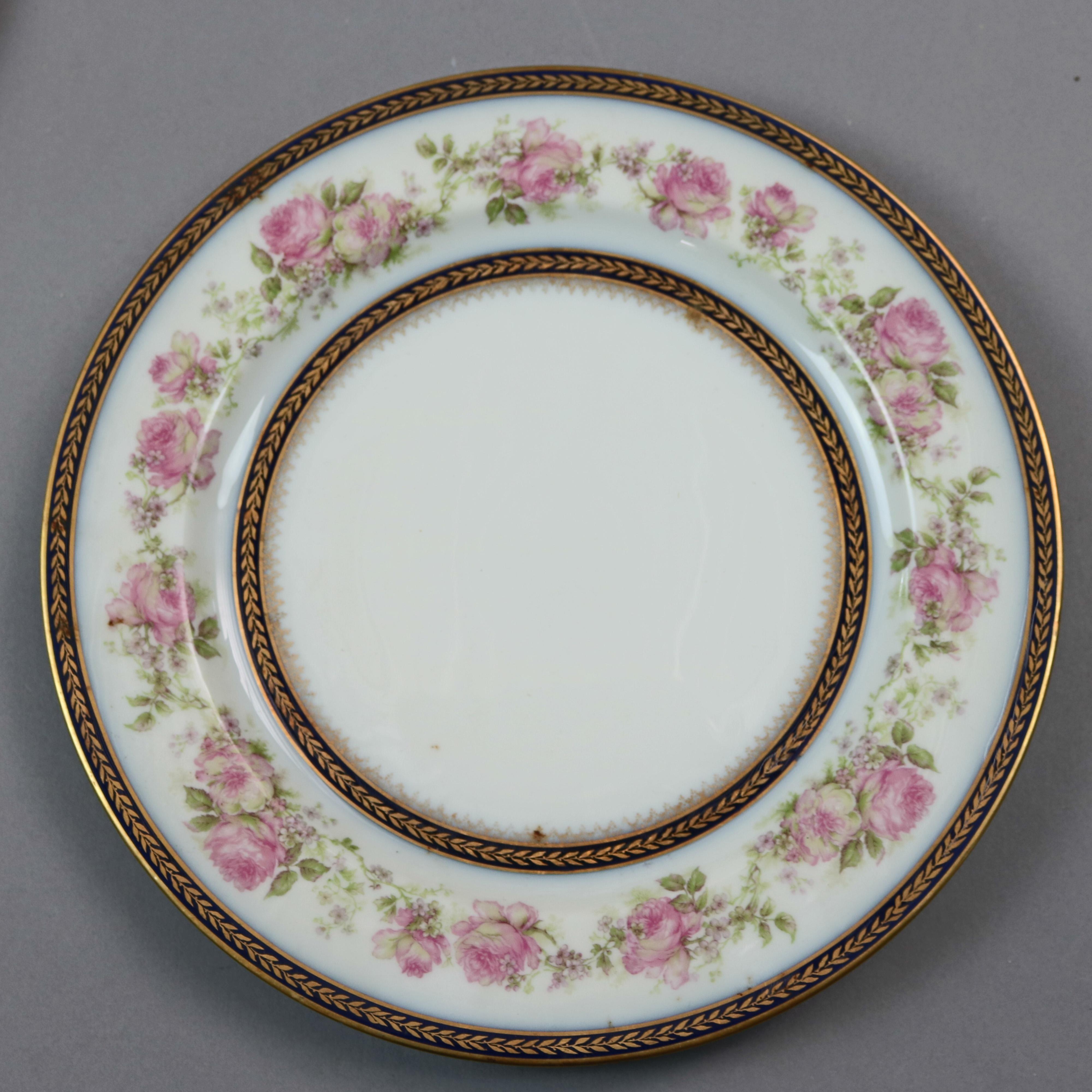 A set of ten French Haviland Limoges porcelain dinner plates offer floral rim with gilt highlights, en verso maker mark as photographed, 20th century.

***DELIVERY NOTICE – Due to COVID-19 we are employing NO-CONTACT PRACTICES in the transfer of