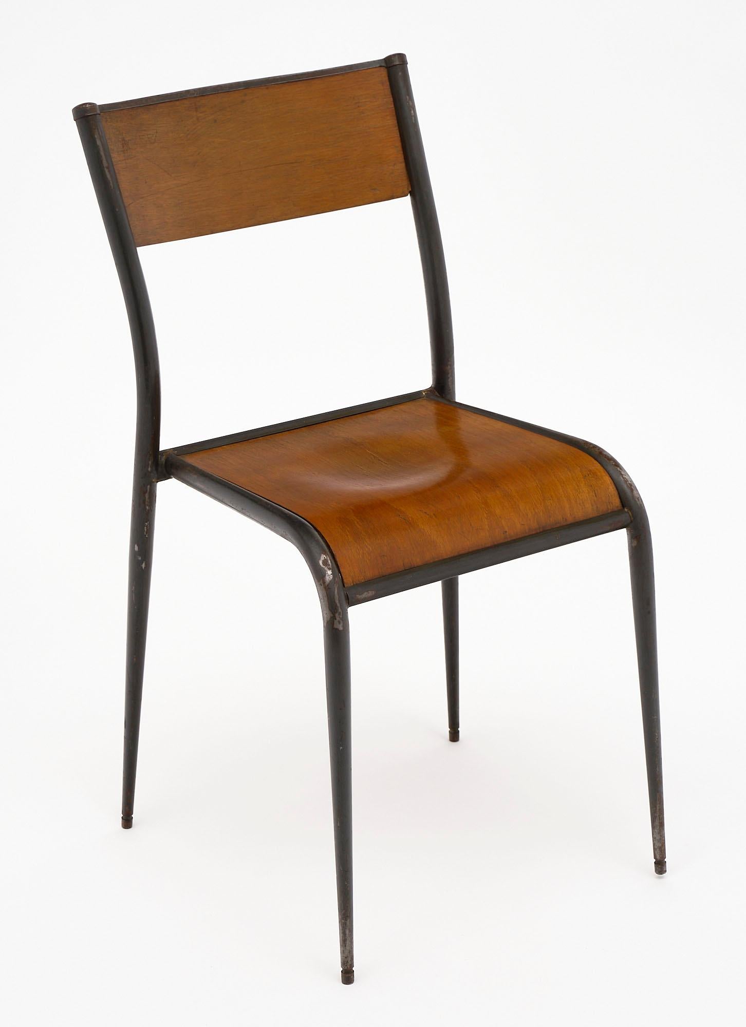 Set of 10 French industrial chairs from a silk manufacturer in the Lyon region. They feature the original painted steel and formed beech wood. The chairs are not identical; there are several different distinctive details for this superb set (shown