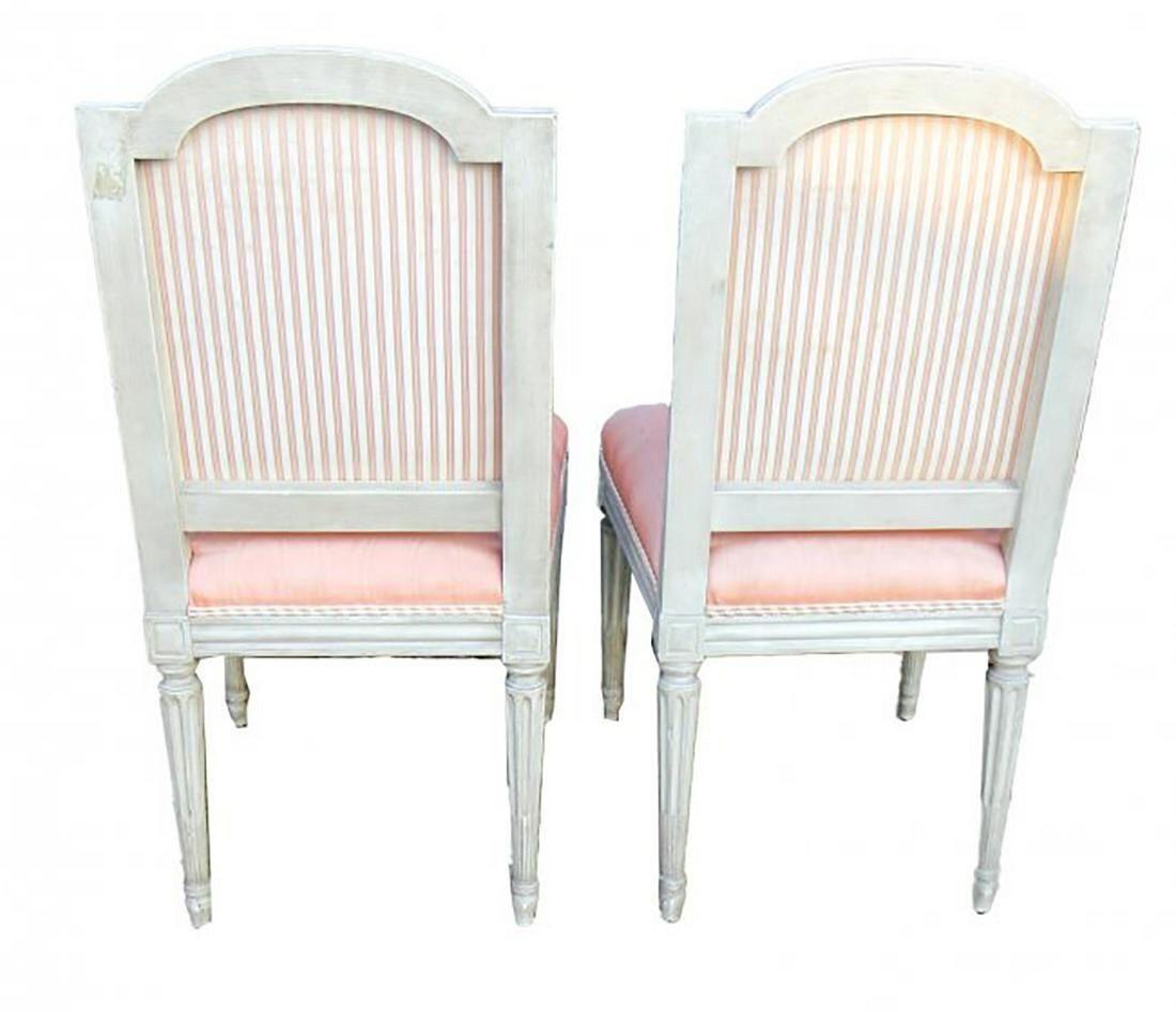 Great set of 10 French Louis XVI style carved and painted side chairs. Upholstered in a pink fabric. Note: There are some stains on the fabric, but the overall condition of the chairs is good. Very nice!!