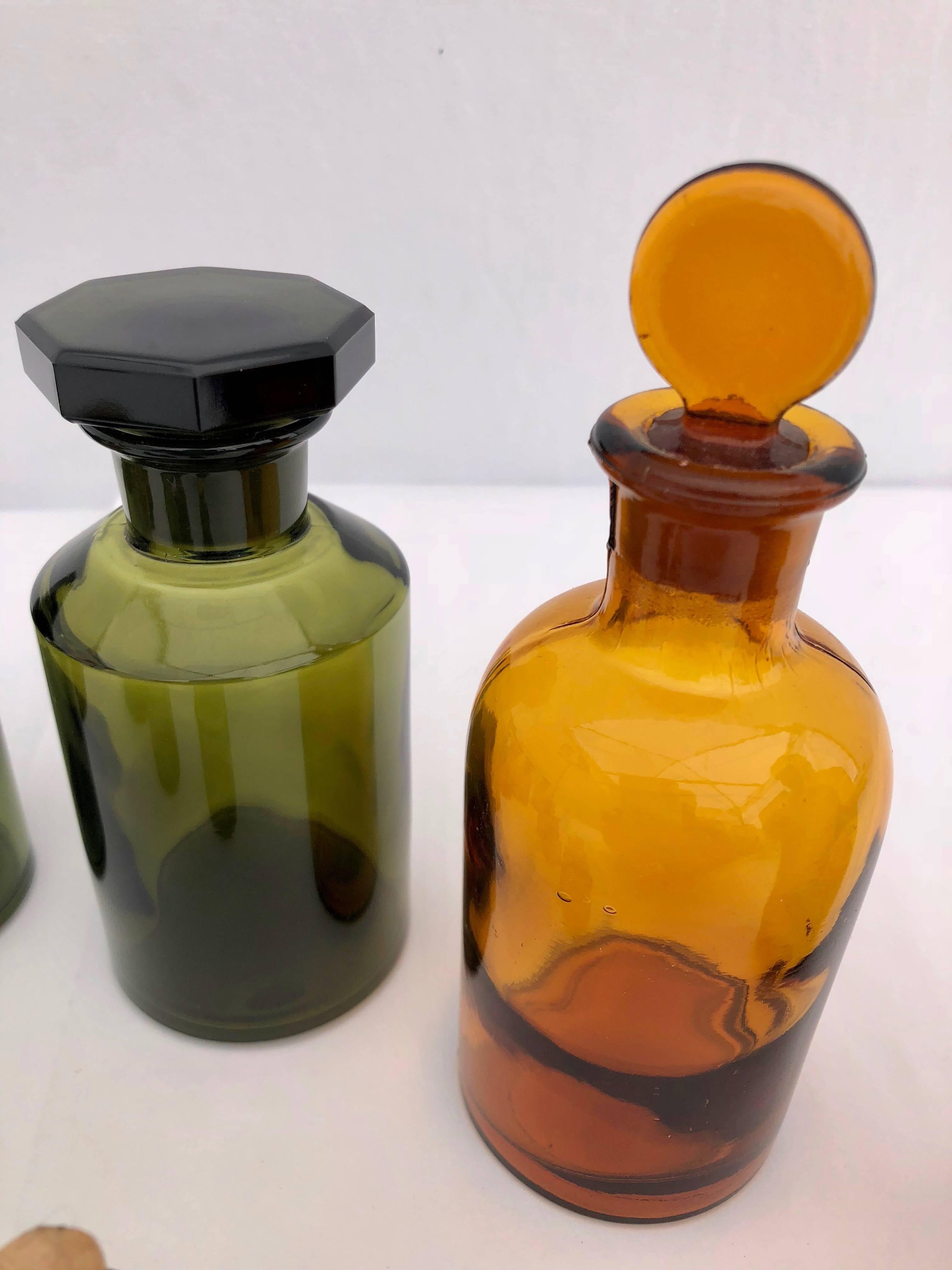 20th Century Set of 10 French Perfume-Pharmacy Bottles in Green and Amber, with Lids/Stopper For Sale