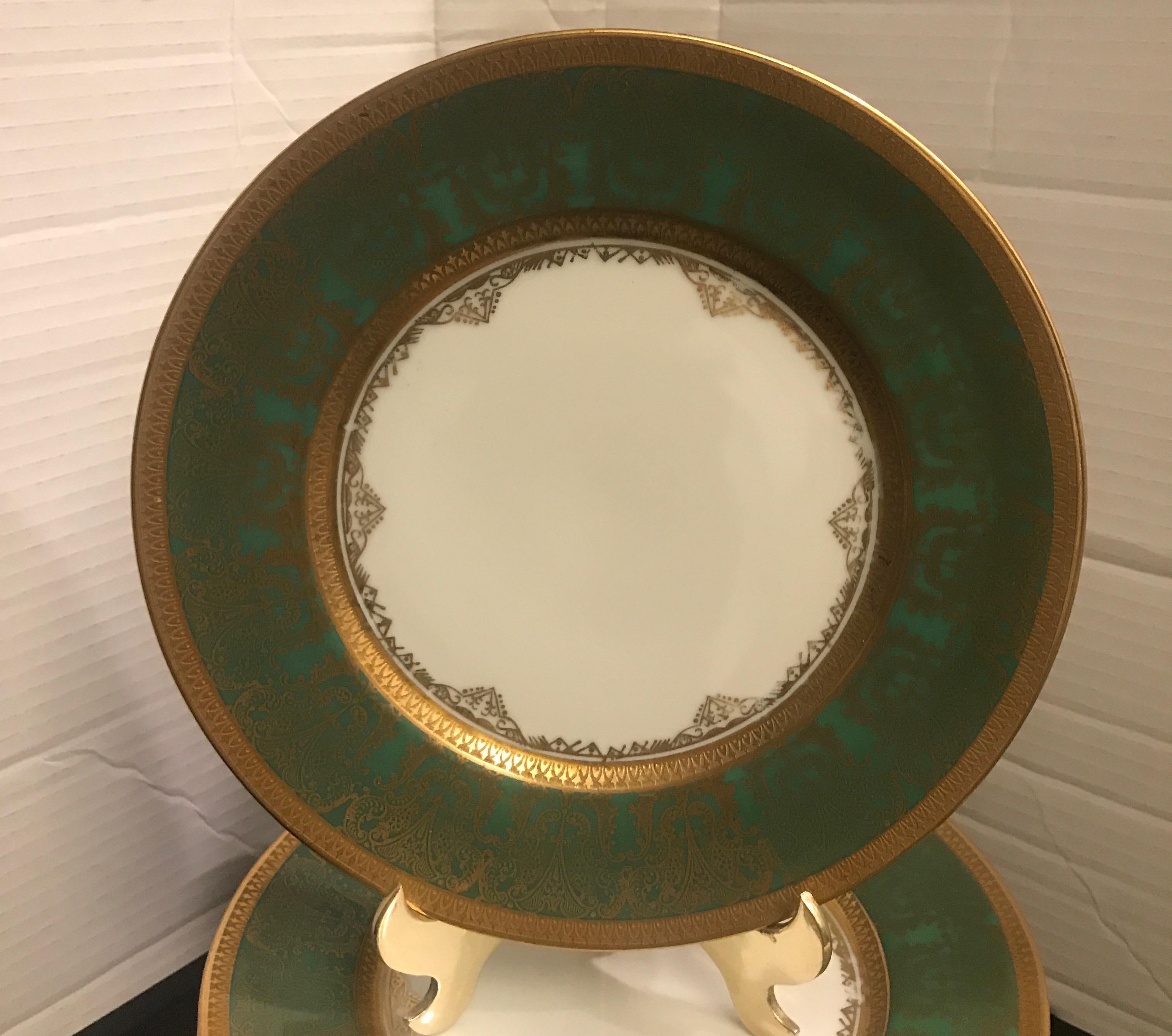 A set of 10 rich green and gold encrusted accent plates by Sommer & Matschak. The plates are 8.75 inches in diameter and are stunning when used on with other plates with a rich gold border, Circa 1905-1910.