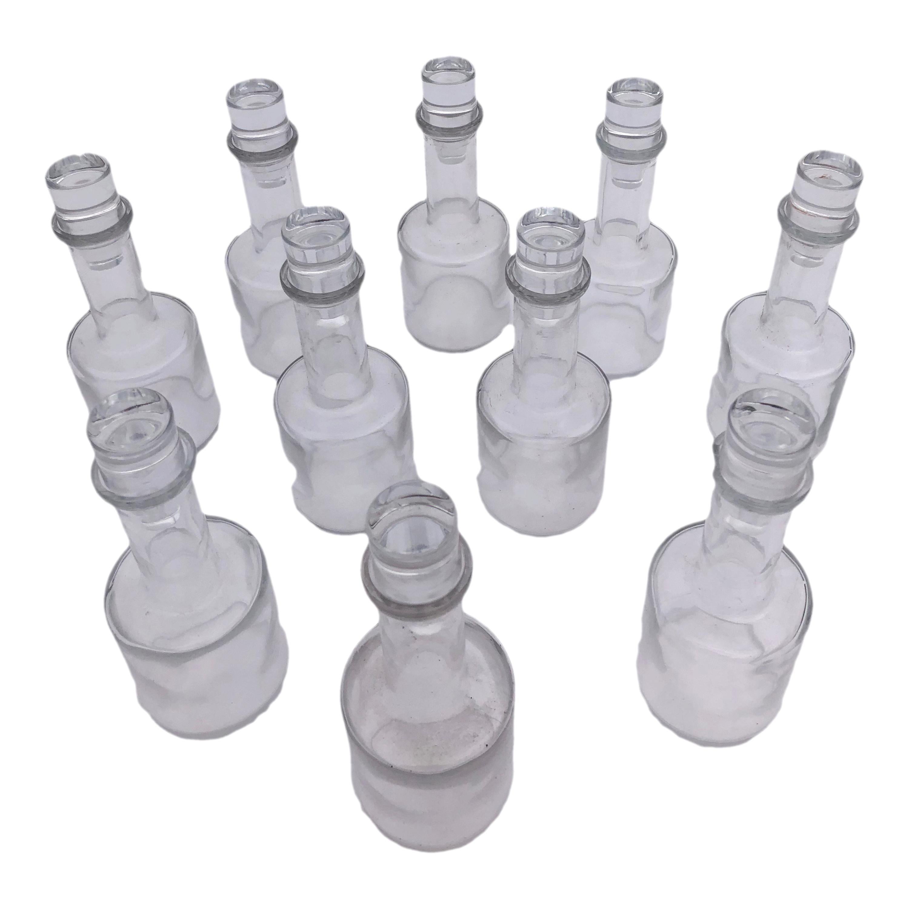 Set of 10 Hand Blown Glass Bottles with Stoppers from a Parisian Restaurant For Sale