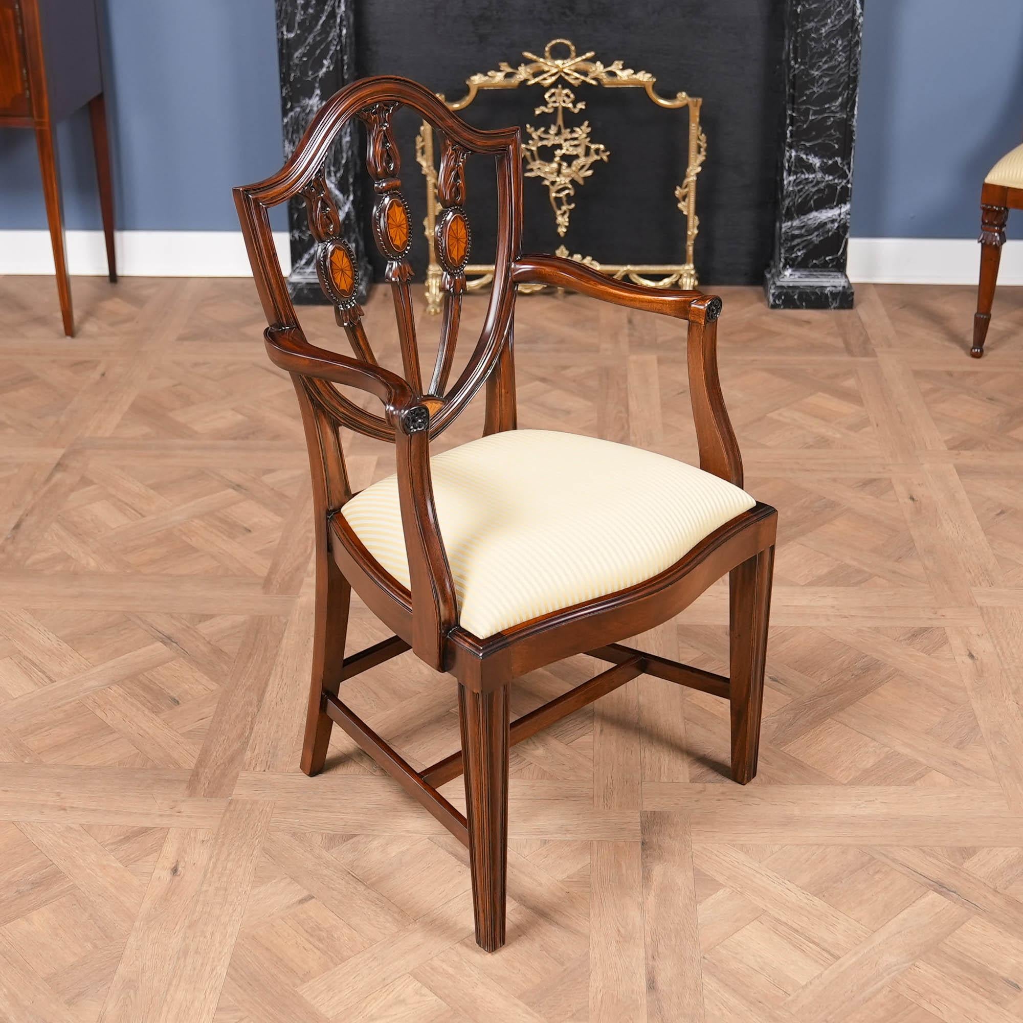 This set of 10 Inlaid Shield Back Chairs by Niagara Furniture features 2 arm chairs and 8 side chairs. These shield back chairs are taller than many traditional shield back design chairs allowing the homeowner to see the beautiful workmanship in the