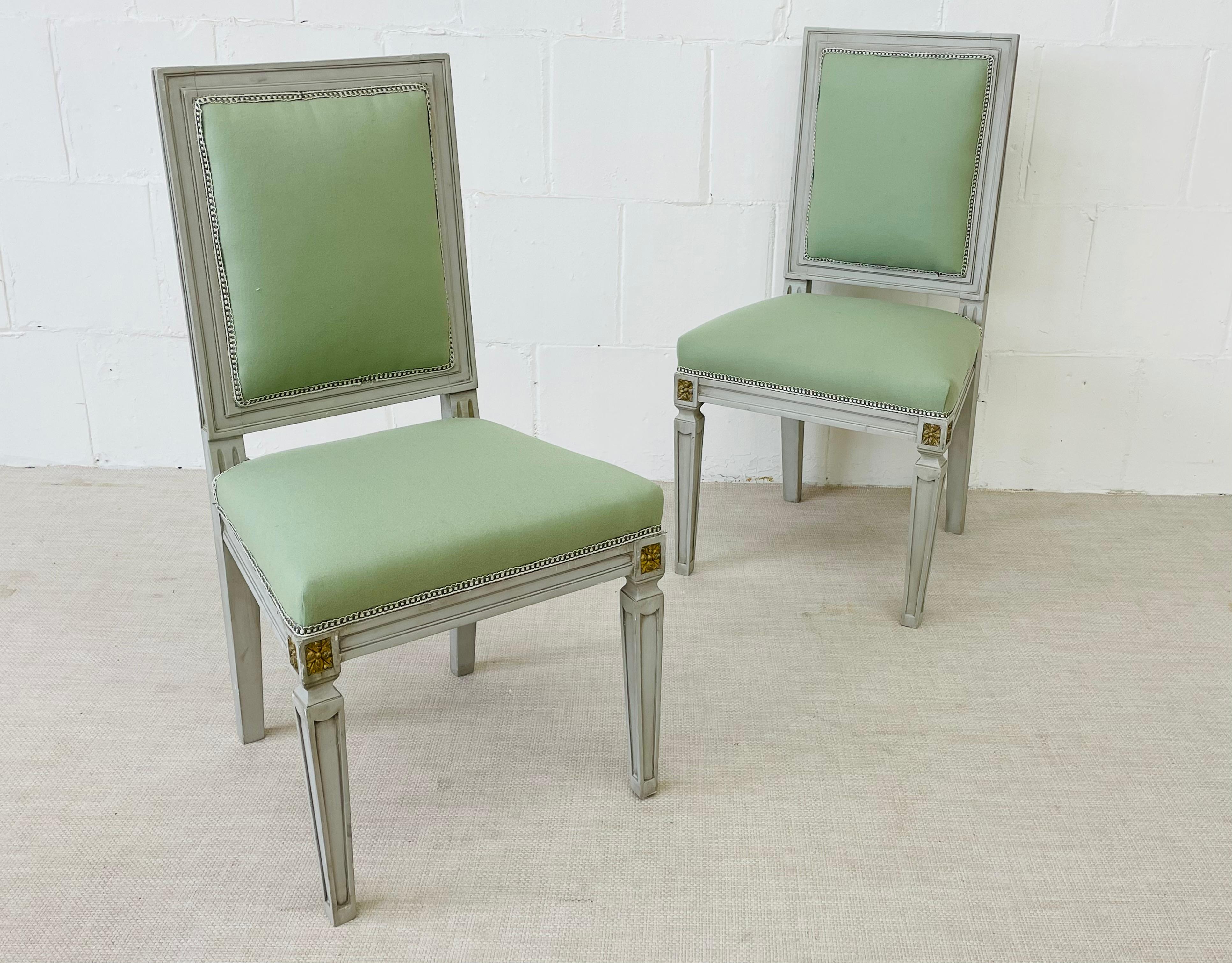 A set of 10 Hollywood Regency Jansen inspired parcel gilt and crème paint decorated side chairs. Each having new fabric and in fine condition. All strong and sturdy with tapering legs supporting an apron having gilt decorated corners leading to