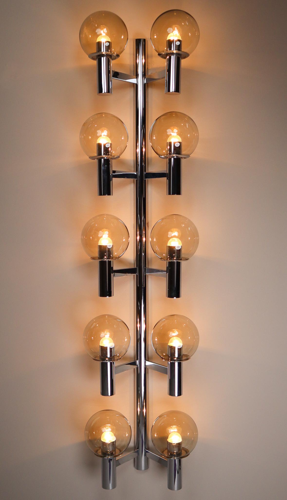 Set of 10 large Mid-Century Modern chrome wall lights- sculptures produced in Italy, 1970s. The pleasant light it spreads is very atmospheric, these wall scones or fixtures will contribute to a luxurious character of the (hotel-bar) interior.
