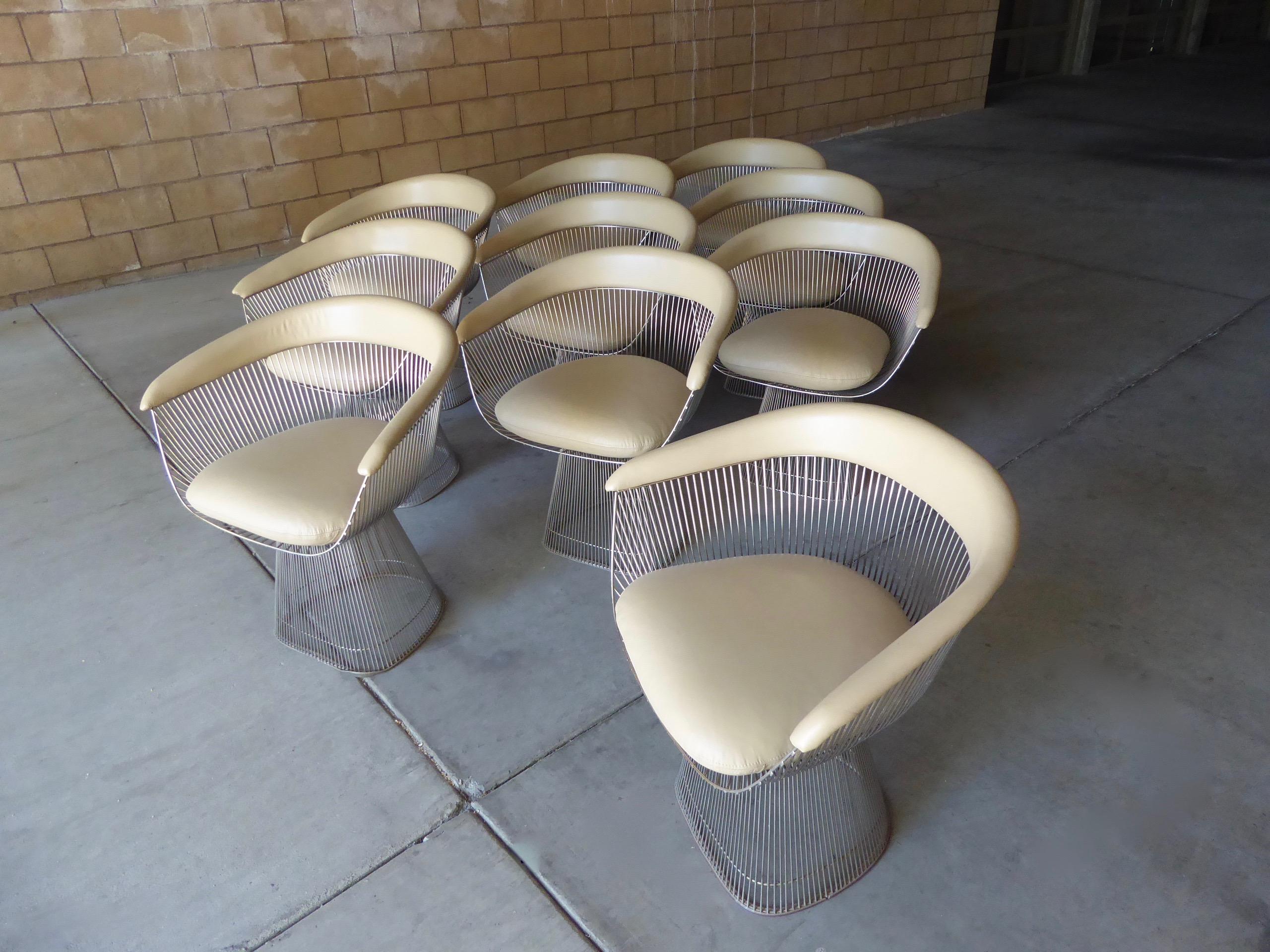 The iconic steel rod dining chair was designed by Warren Platner for Knoll in 1966. This rare set of ten 1970s vintage chairs is upholstered in a buttery-soft taupe/ecru colored leather by Edelman. These chairs are in fantastic condition with a