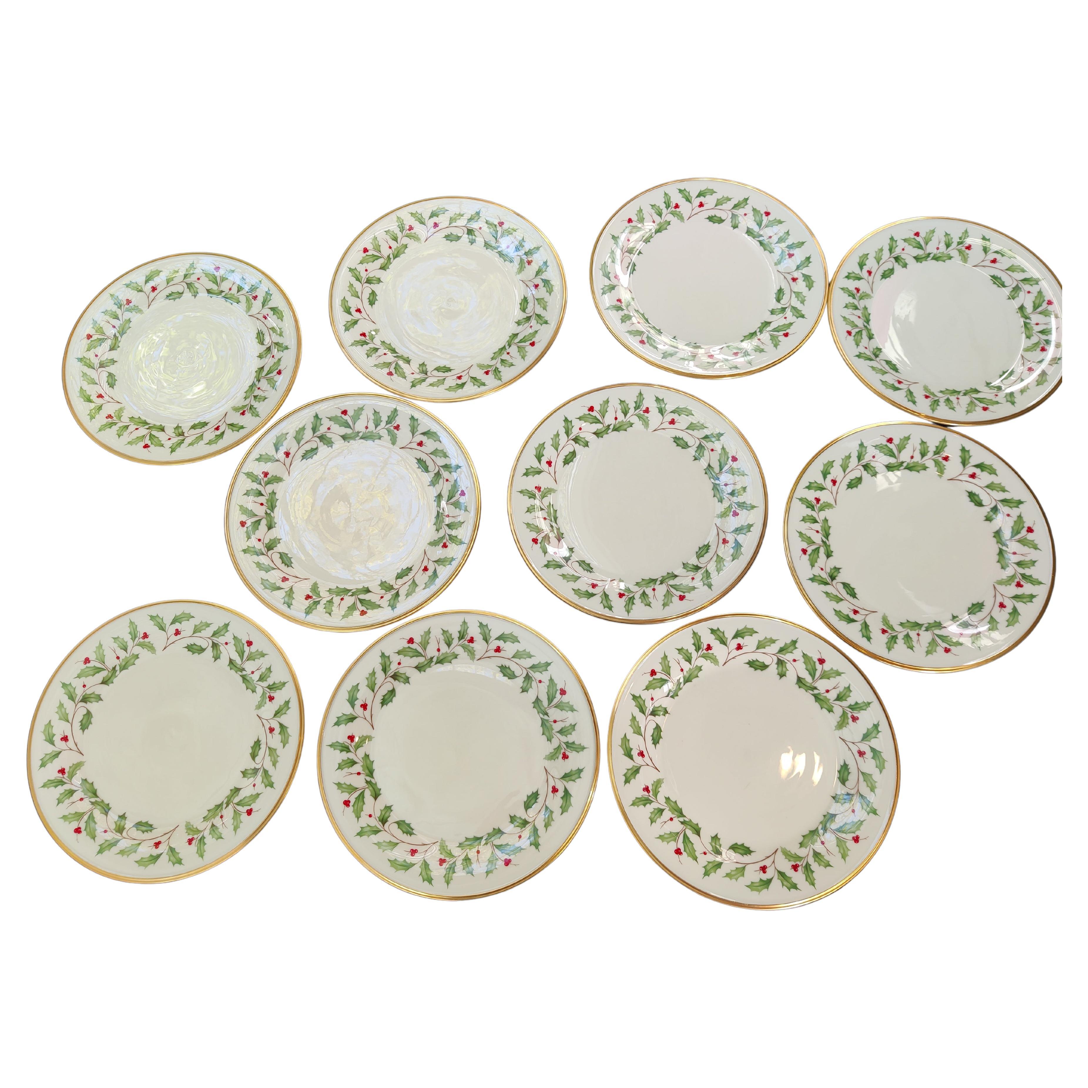 Set of 10 Lenox Christmas Plates.
Ivory Bone China.
Holly and Red Berry Design with 24K Gold Rim.
