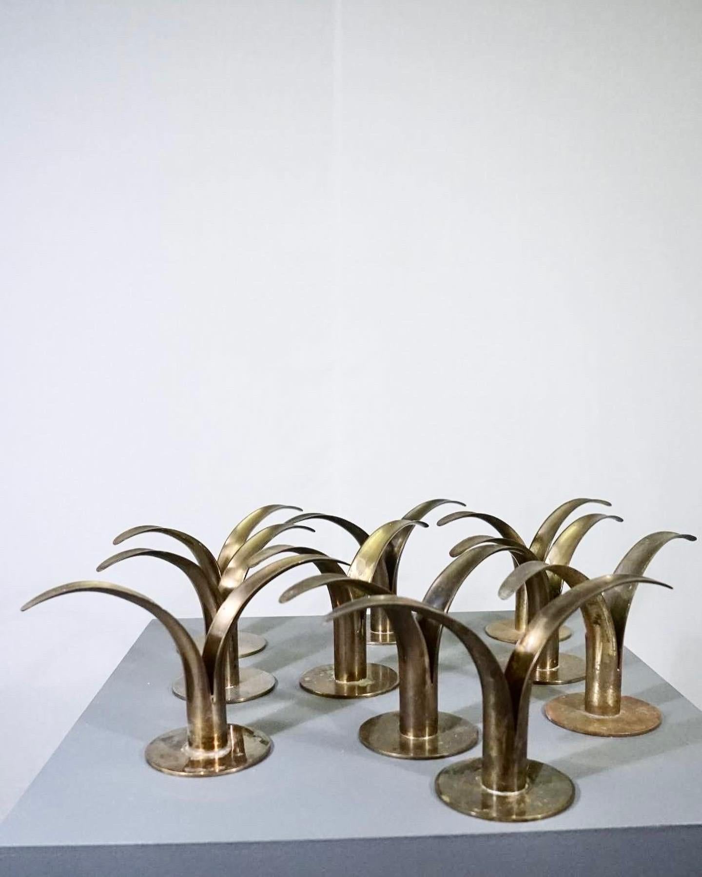 Patinated Set of 10 lily candle holders designed by Ivar Ålenius Björk for Ystad Metal For Sale