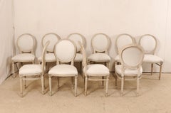Set of 10 Louis XVI Style Upholstered and Carved Wood Oval-Backed Dining Chairs