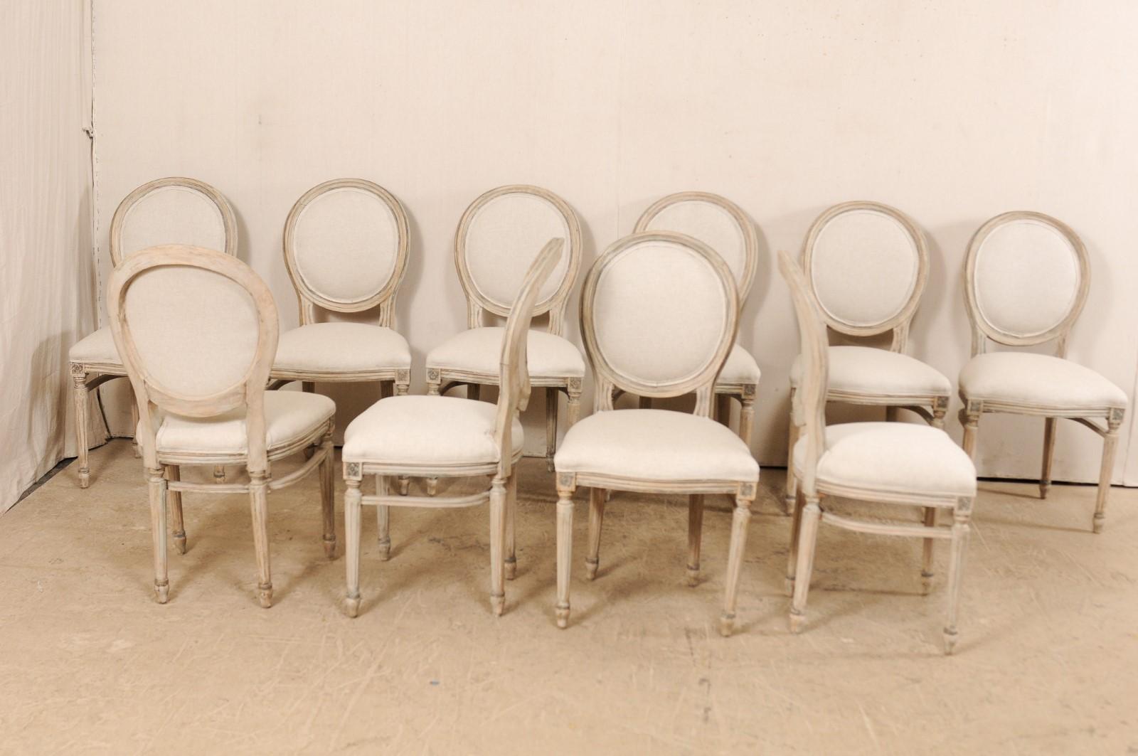 Set of 10 Louis XVI Style Upholstered and Carved Wood Oval-Backed Dining Chairs In Good Condition In Atlanta, GA