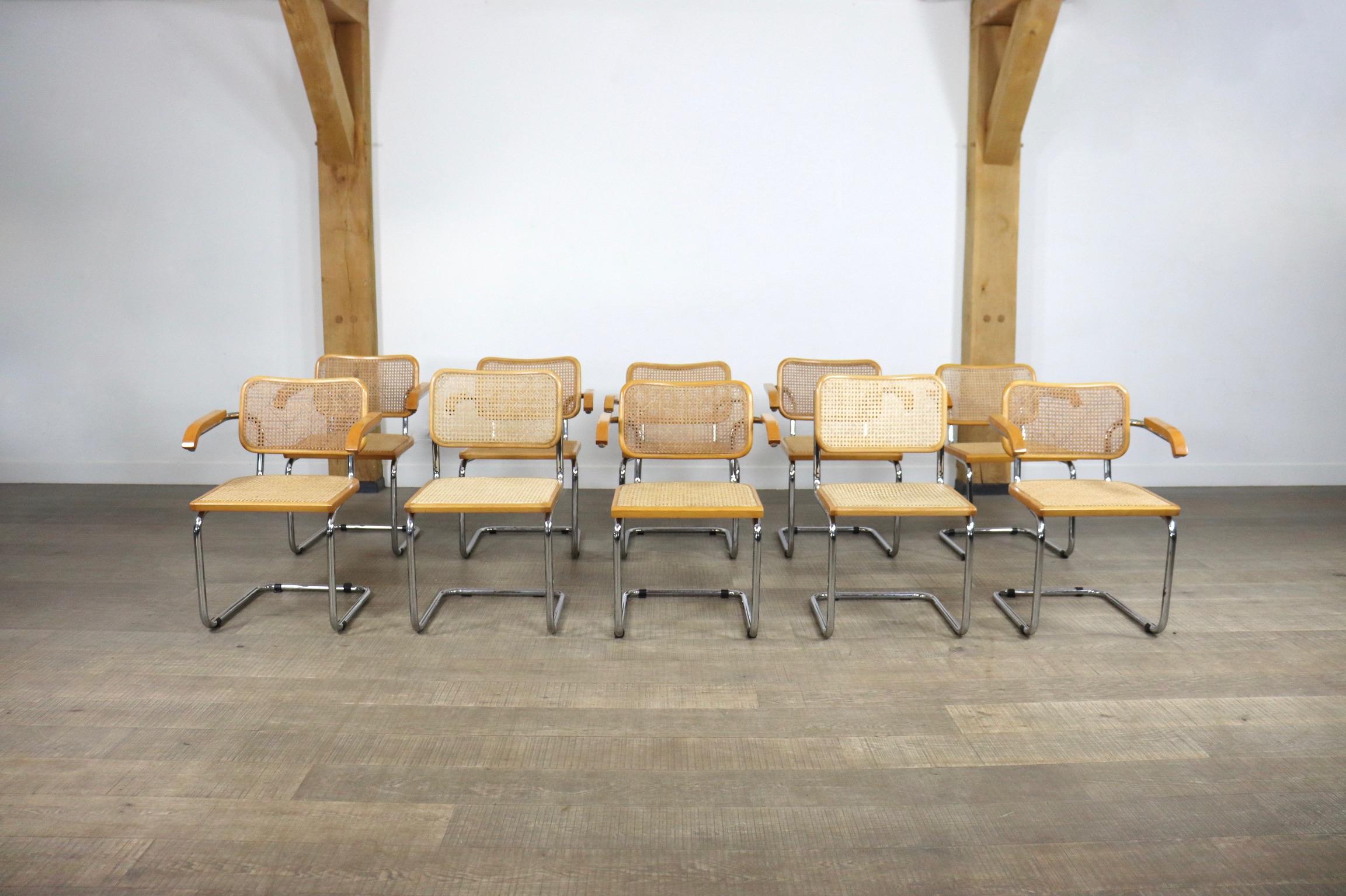 Set of 10 vintage chrome and rattan dining chairs by Marcel Breuer, model B32. Total of 10 chairs consisting of 8 chairs with armrests (B64) and 2 without (B32). The design originates from 1928, and has become an iconic design over the