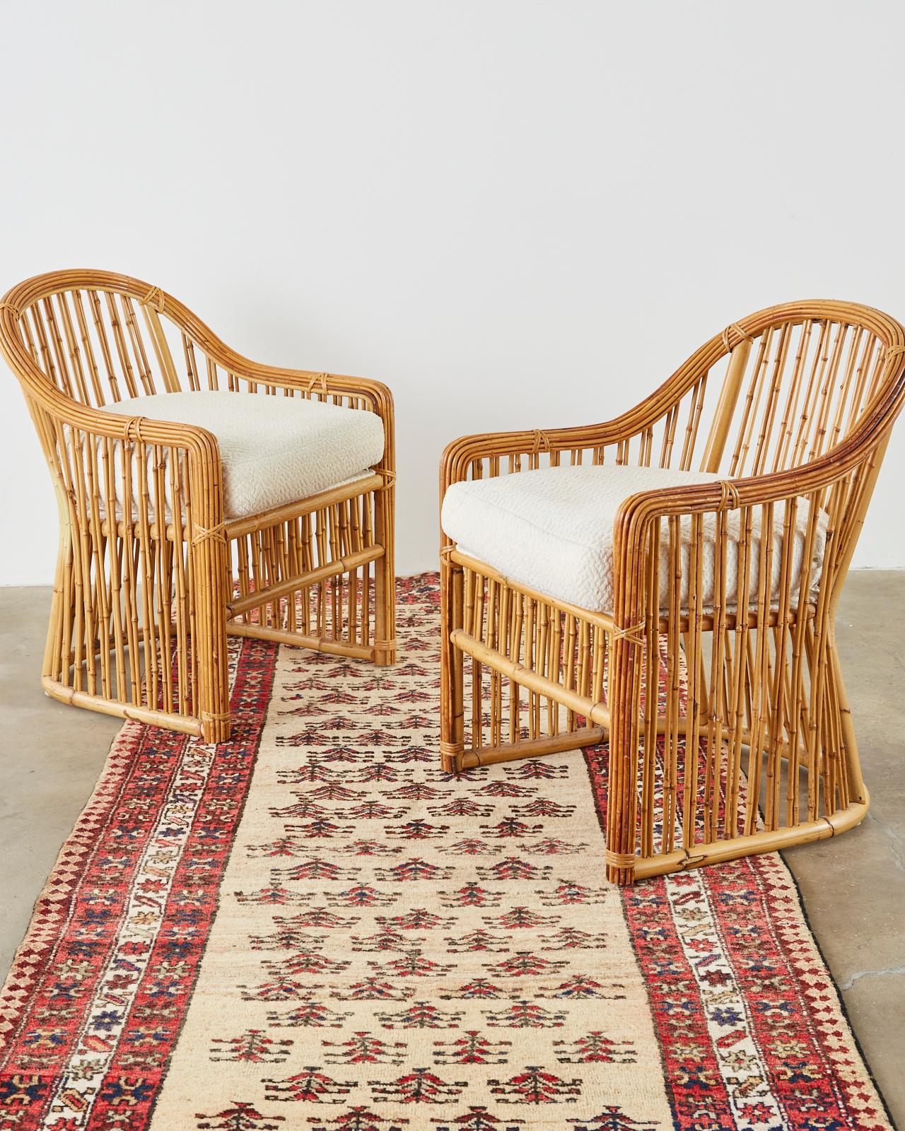 Fantastic set of ten bamboo rattan dining chairs made by Randolph and Hein for Michael Taylor interiors. The chairs feature a classic barrel shaped frame crafted from bamboo poles and reinforced with smaller reeds. The arms gracefully curve around