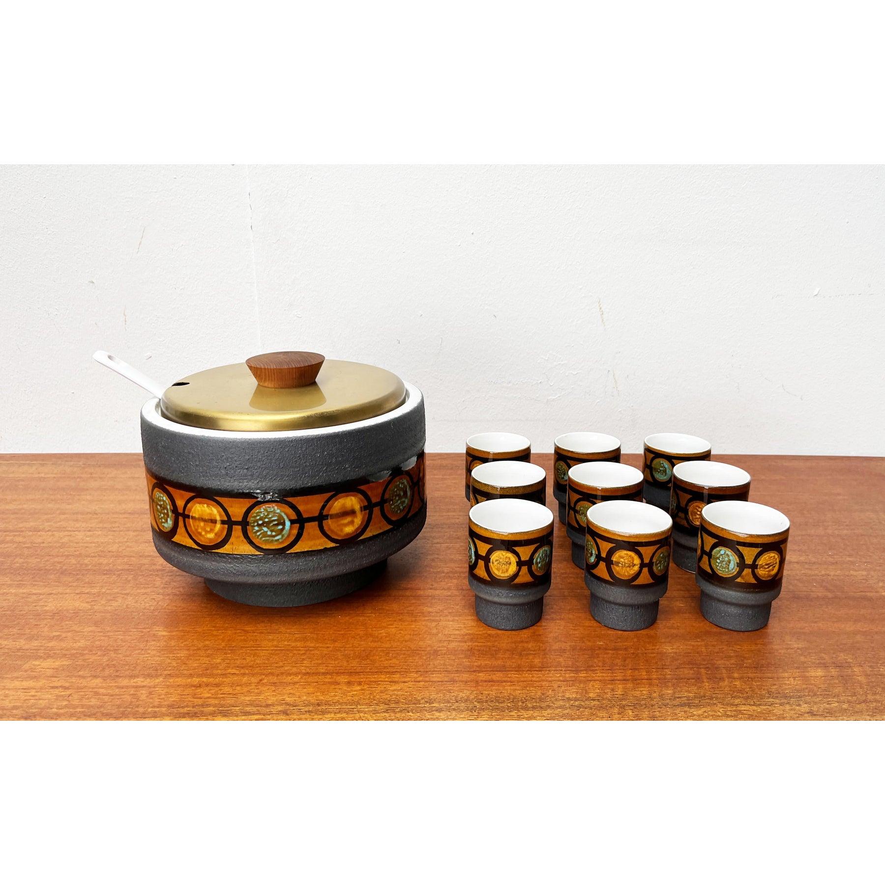 Mid-Century Brutalist West German Pottery WGP Punch Bowl and Cups from Dümler & Breiden, 1960s, Set of 10, in Very Good conditions. Designed 1960 to 1969 This piece has an attribution mark.

Additional information:
Materials: Ceramic, Metal
Color: