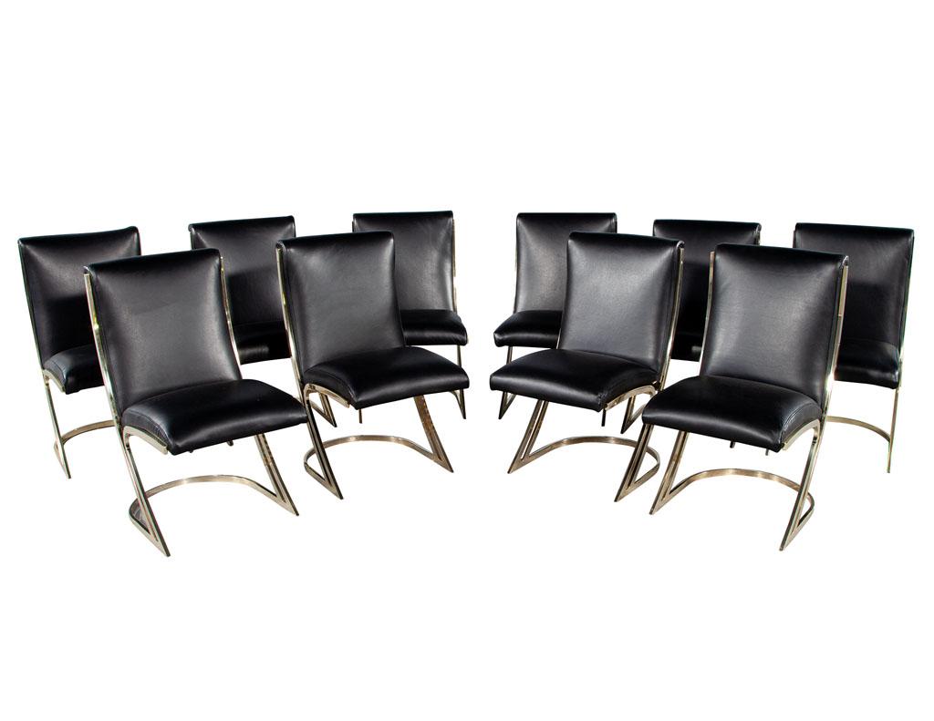 Set of 10 vintage Mid-Century Modern brass dining chairs in black leather. Solid mirror brass frames upholstered in Italian black leather. Brass frames are all original, wear consistent with age and use. Slightly different metal tones, please review