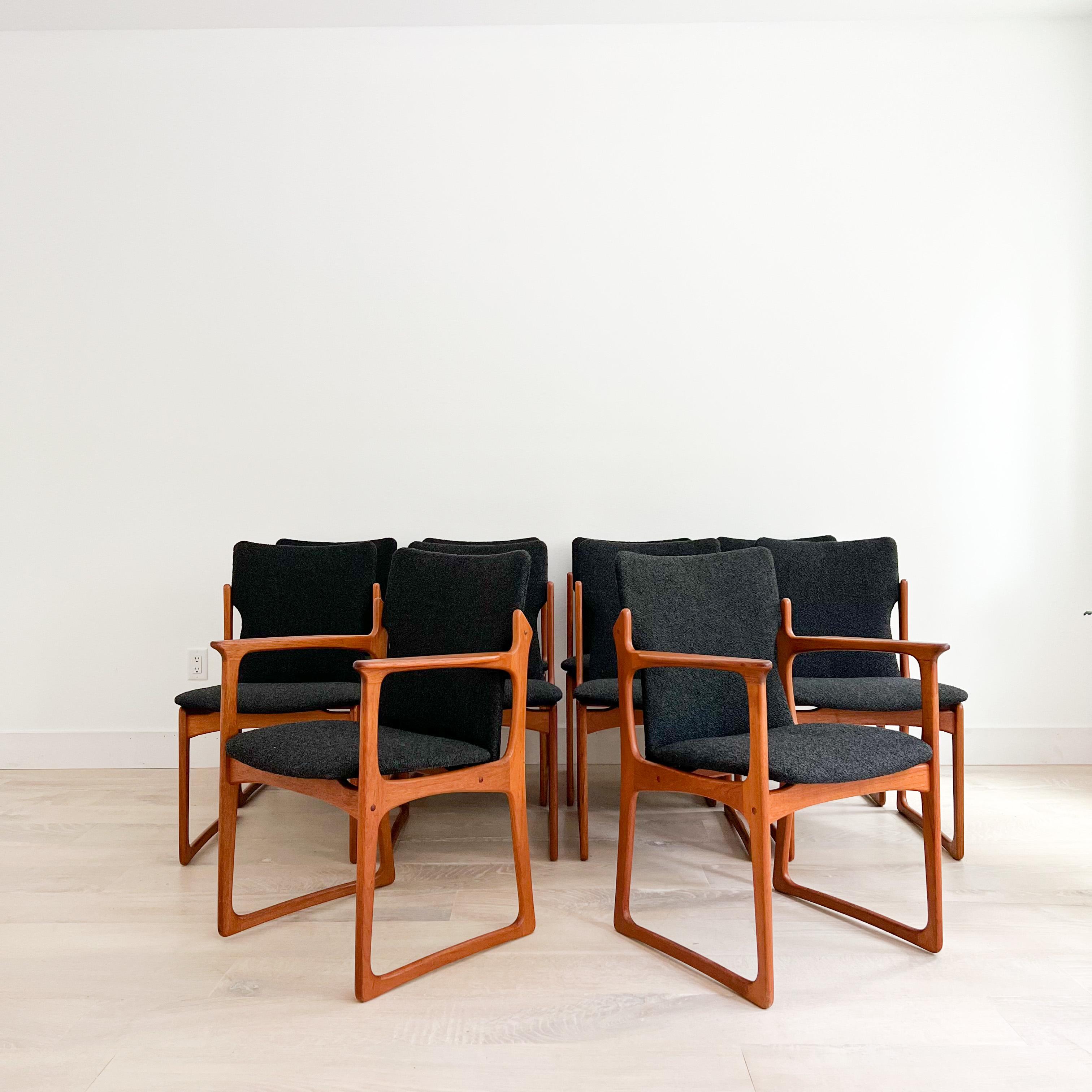 Set of 10 Danish Teak sculpted frame dining chairs manufactured by Vamdrup Stolefabrik. All new black boucle upholstery. Some light scuffing/scratching/darker lines on the chairs. 2 Captain chairs and 8 armless.