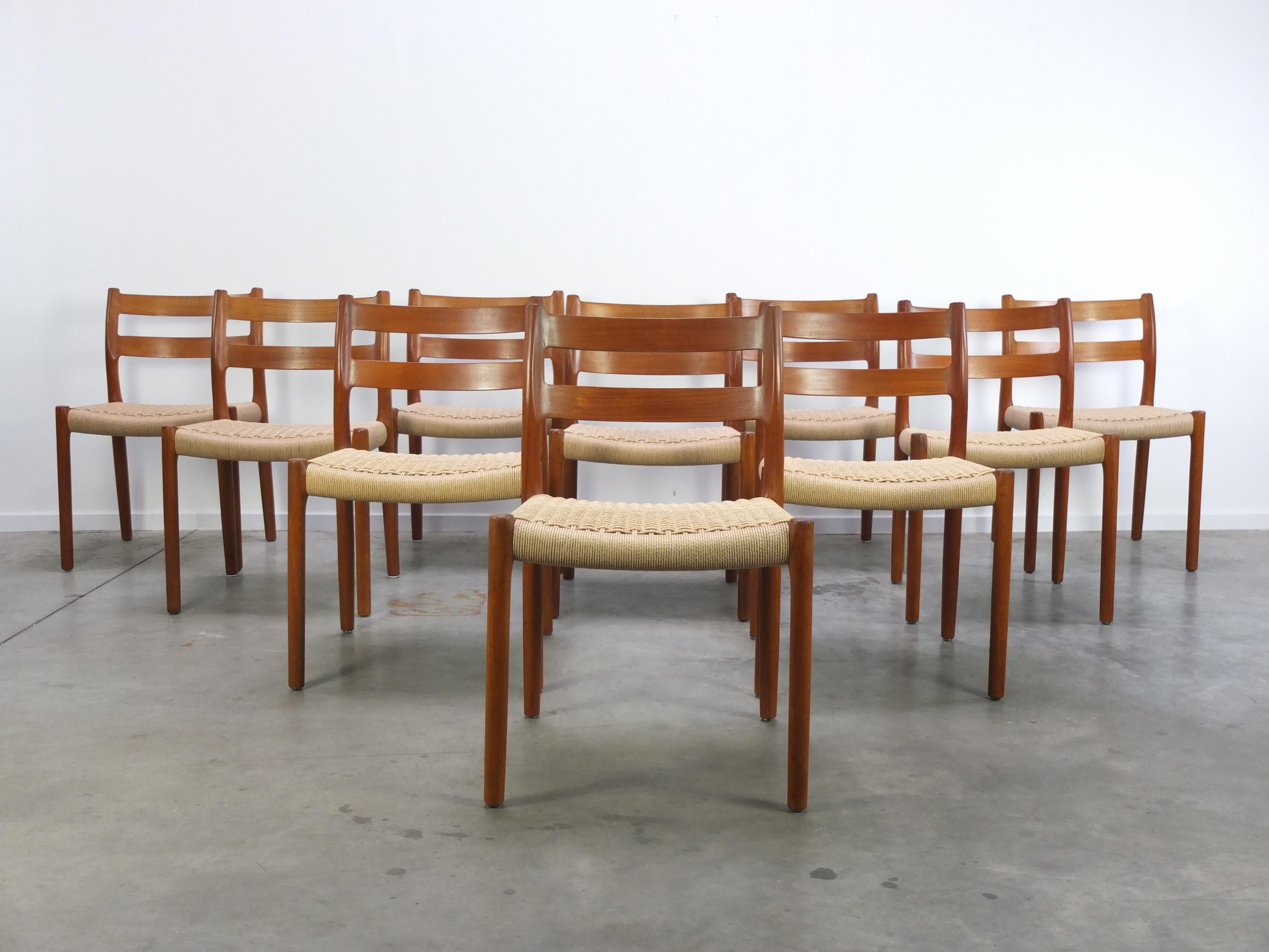 Set of 10 (!) ‘Model 84’ dining chairs designed by Niels O. Møller in the 1960s. These chairs are made of a beautiful solid teak wood frame with fully renewed papercord seatings. Produced by J.L. Møllers Møbelfabrik in Denmark. In perfect restored