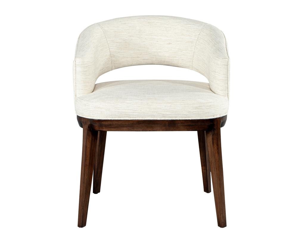 Elevate your dining experience with this exquisite set of 10 Carrocel custom Aalto dining chairs, masterfully designed and handcrafted by the skilled artisans at Carrocel. These chairs feature a stunning contoured curved open back that not only