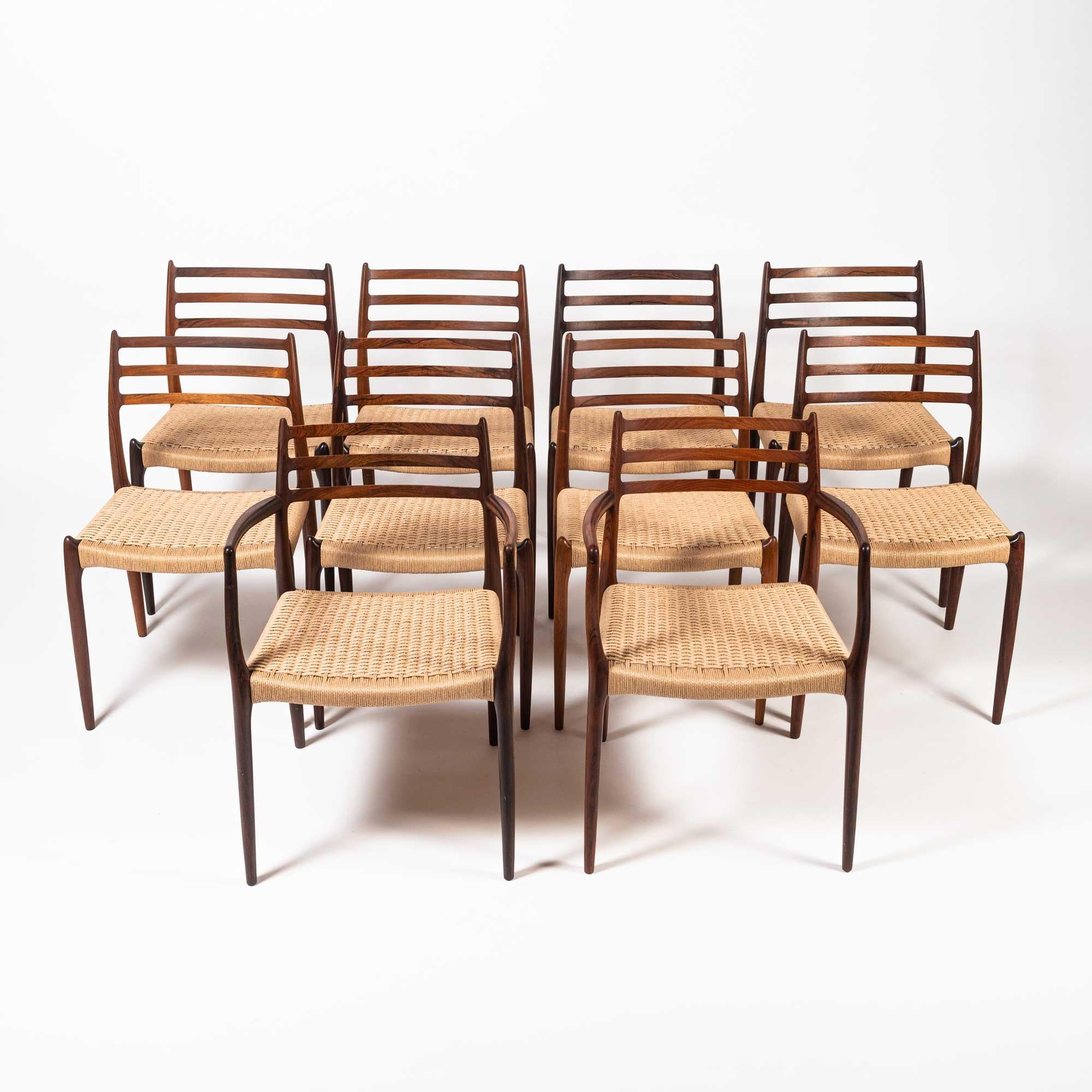 Rare and iconic set of 10 rosewood dining chairs designed by Niels Otto Moller for JL Møller Møbelfabrikin 1954. The set comprises of eight model #78 chairs and two model #62 carver armchairs. The set has been completely restored, with all new