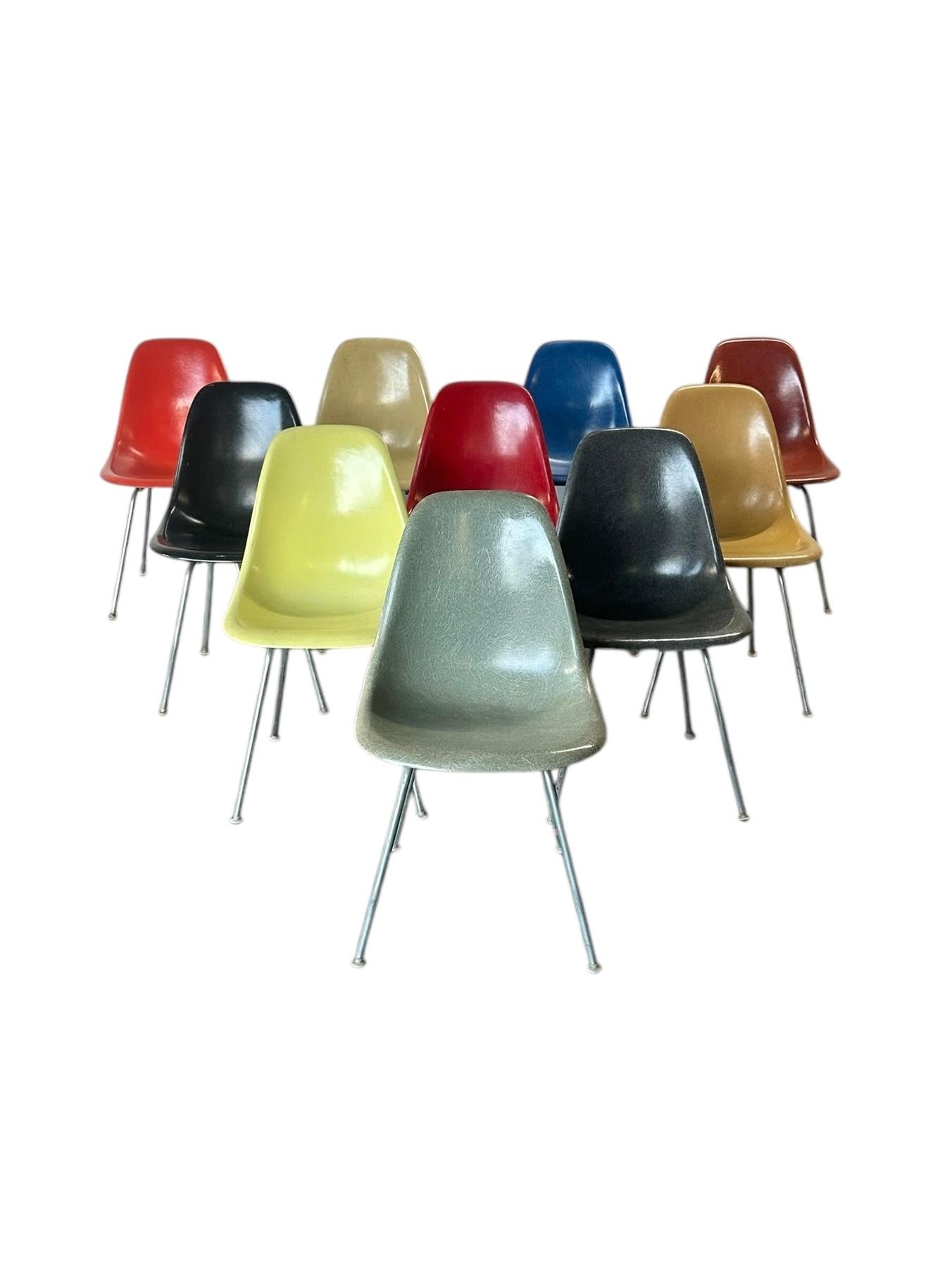 Set of ten different color Herman Miller fiberglass dining chairs. Original production, not the new ersatz ones. All in good condition with all screws and feet intact. All signed and guaranteed authentic. Featuring original Herman Miller H bases in