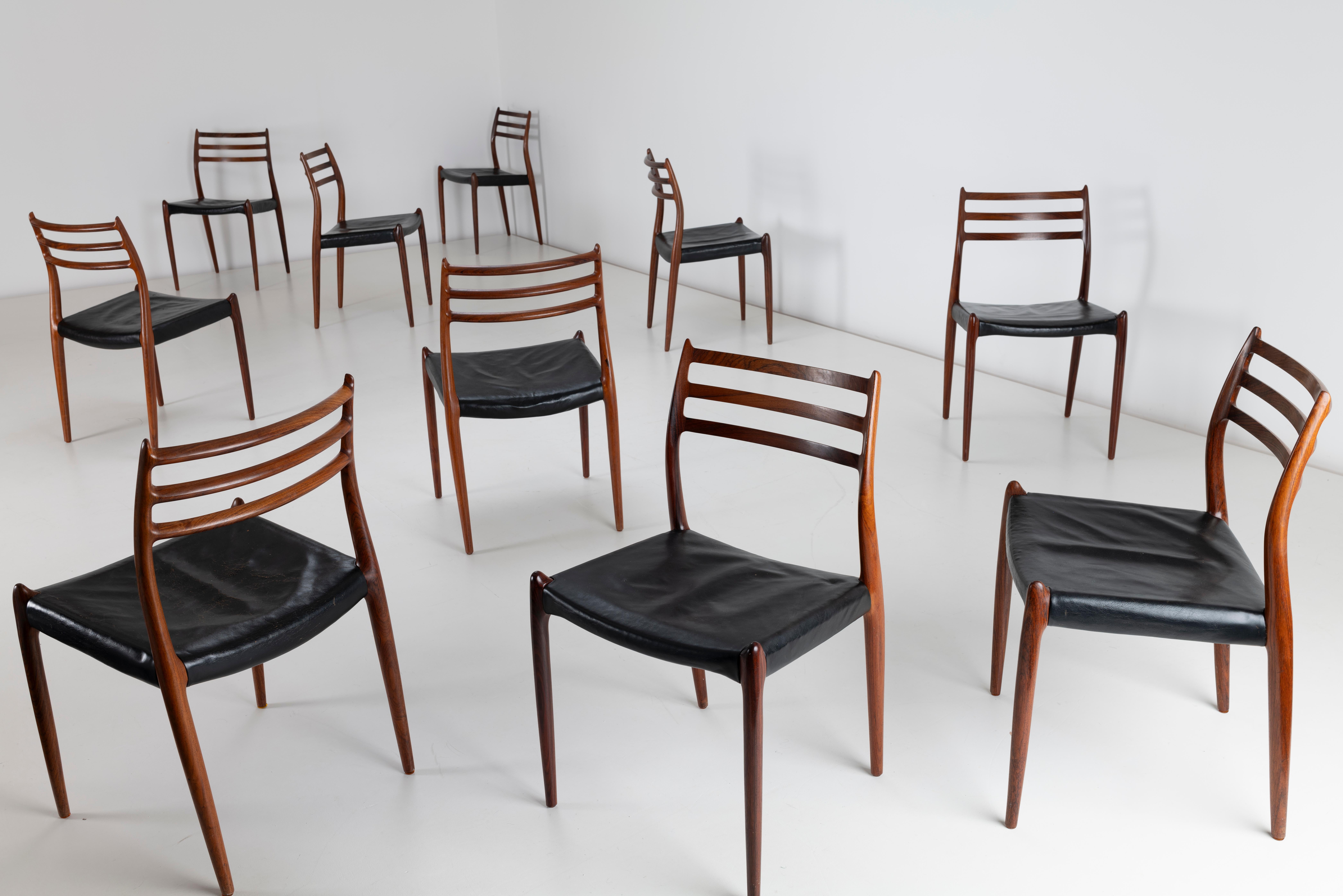 A stunning Set of 10 Niels Møller Model 78 Dining Chairs in Brazilian rosewood with their original black leather upholstery, this collection is a rare find that showcases the pinnacle of Danish design and craftsmanship.

Designed by the masterful