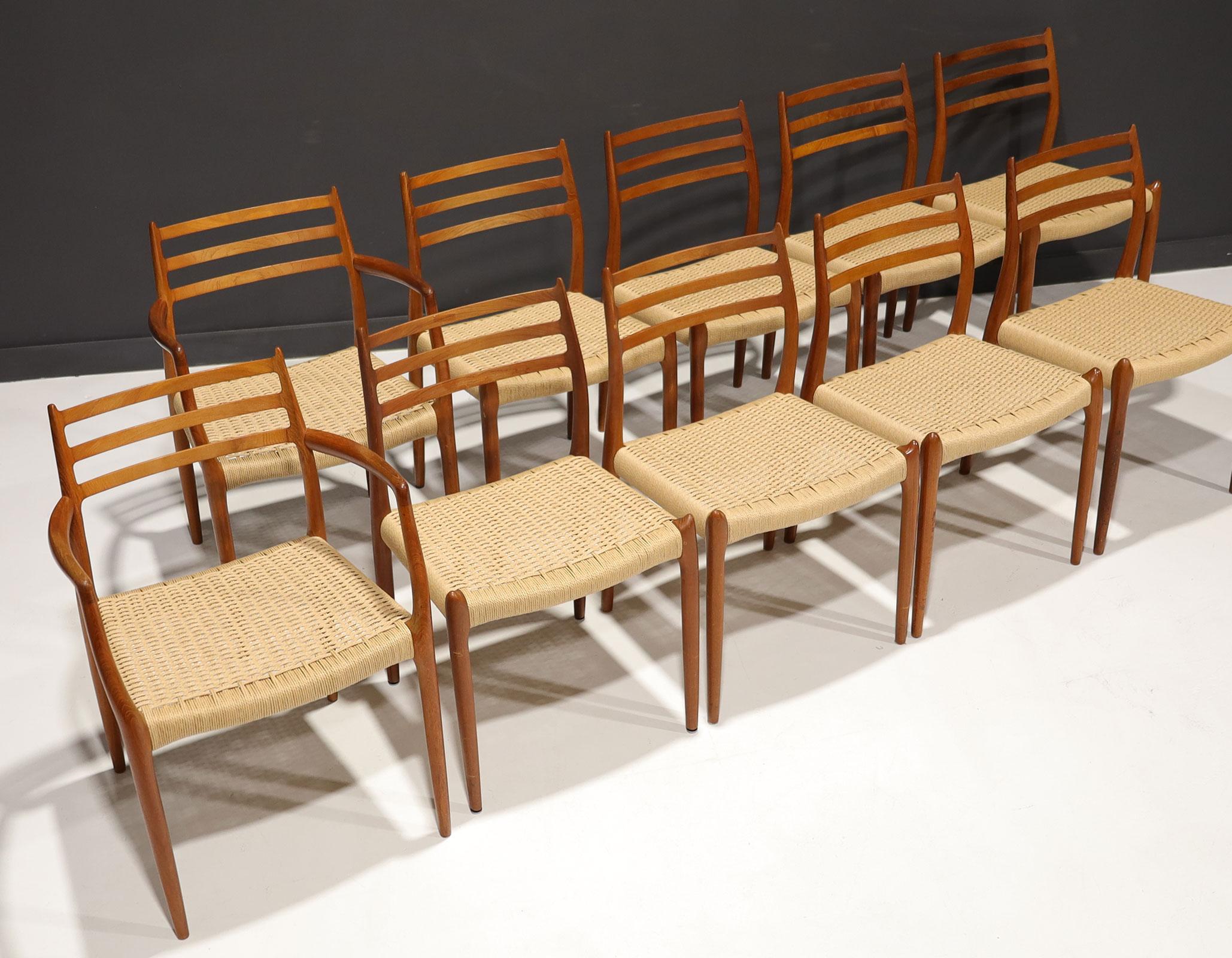 Designed by Niels O. Moller for J.L. Moller Mobelfabrik, Denmark, 1962. We have restored the papercord seats by an expert caning craftsman. They are beautiful ! Side chairs measure 32