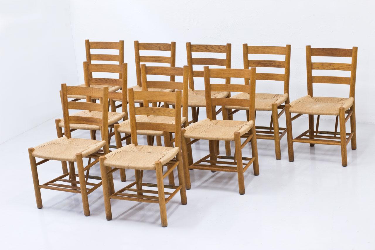 Set of ten church chairs designed by Viggo Hardie-Fischer, manufactured by Sorø Møbelfabrik in Denmark during the 1950s. Chair model in the manner of Kaare Klint designs.
Oak frame with paper cord seat.
This chair model have been designed and used