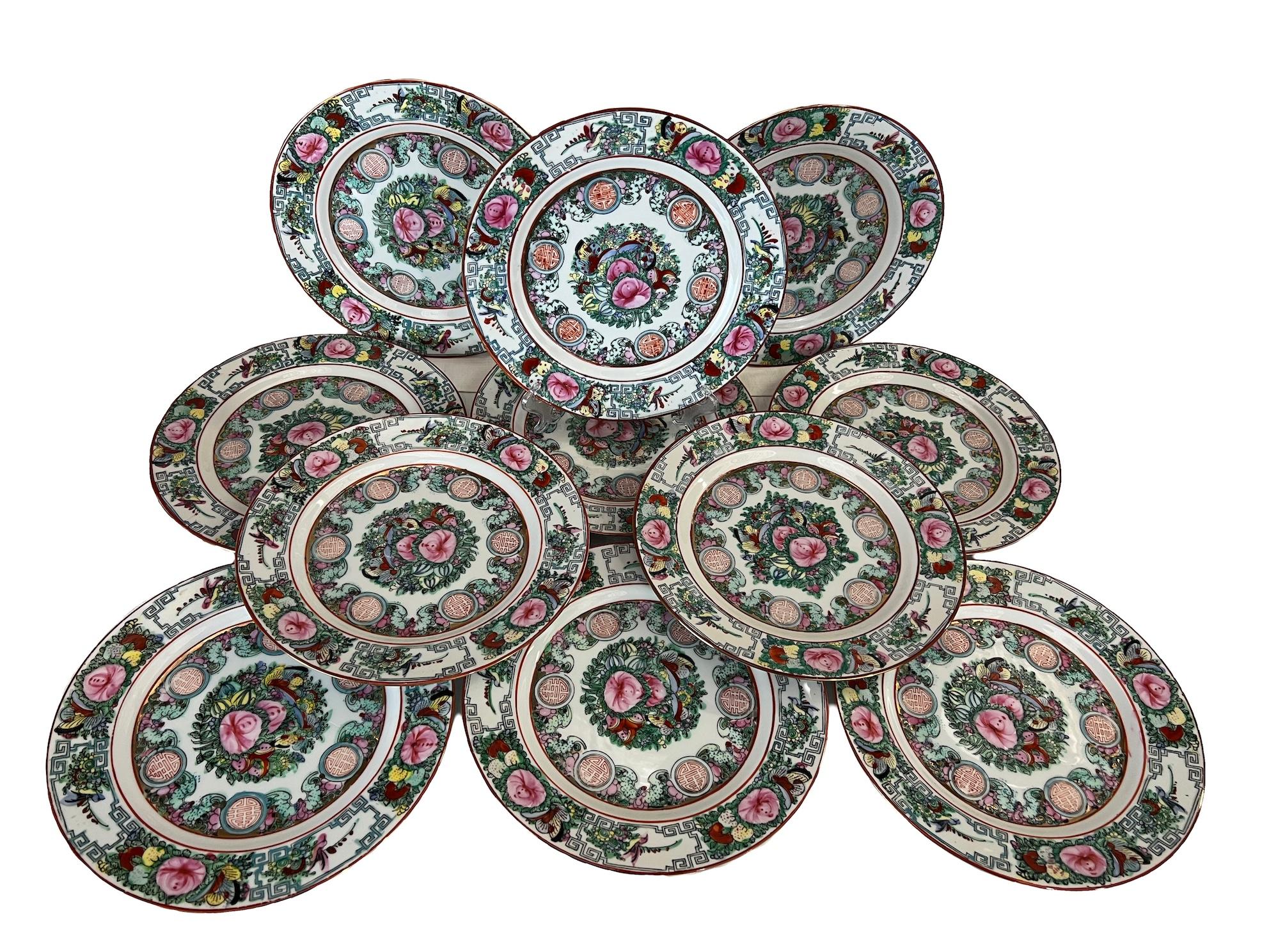 Set of 10 Chinese porcelain dinner plates. These Guang Cai plates, also known as 'three-color plates' or 'family rose plates' in Chinese, are a type of Chinese porcelain known for its vibrant color palette and intricate decoration. These plates are