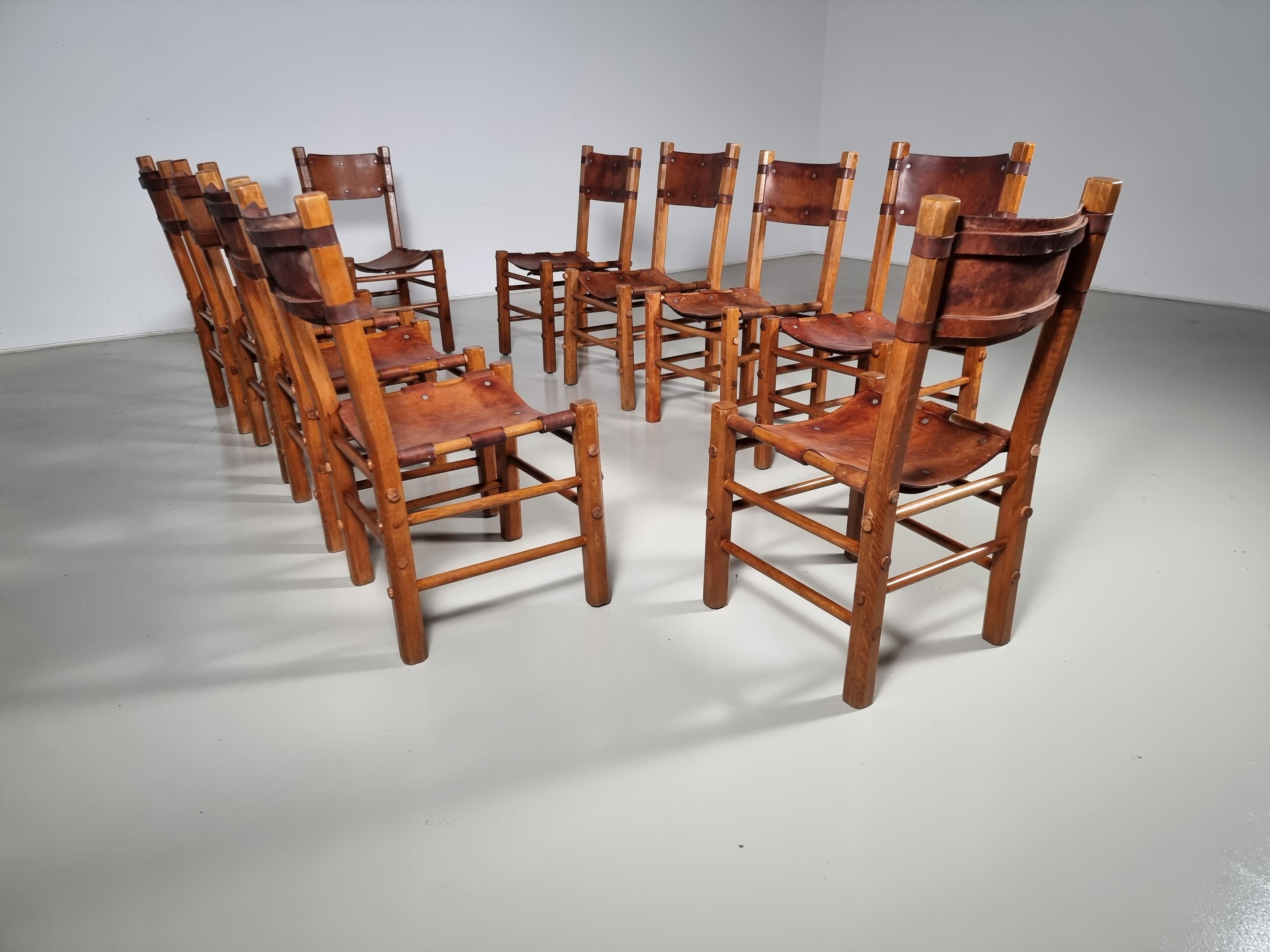 Set of 10 beautiful handmade leather and wood dining chairs from France, 1960s.

Amazing patina to the leather and nailheads. These pieces would blend beautifully in a modern farmhouse or a rustic cabin in the mountains. 

