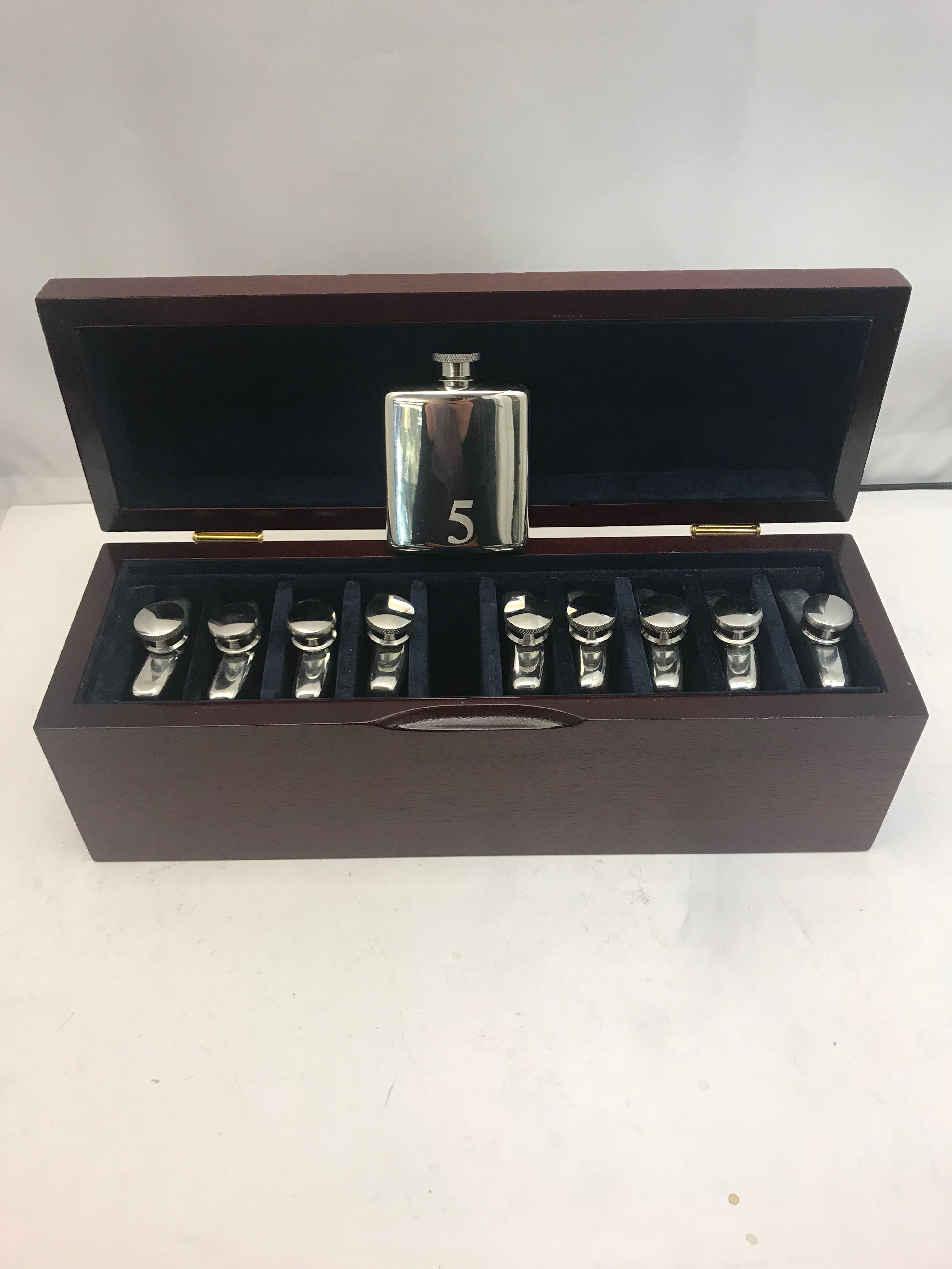 Set of 10 numbered silver plate flasks in a fitted wooden box. Ideal for 'Butt markers'.