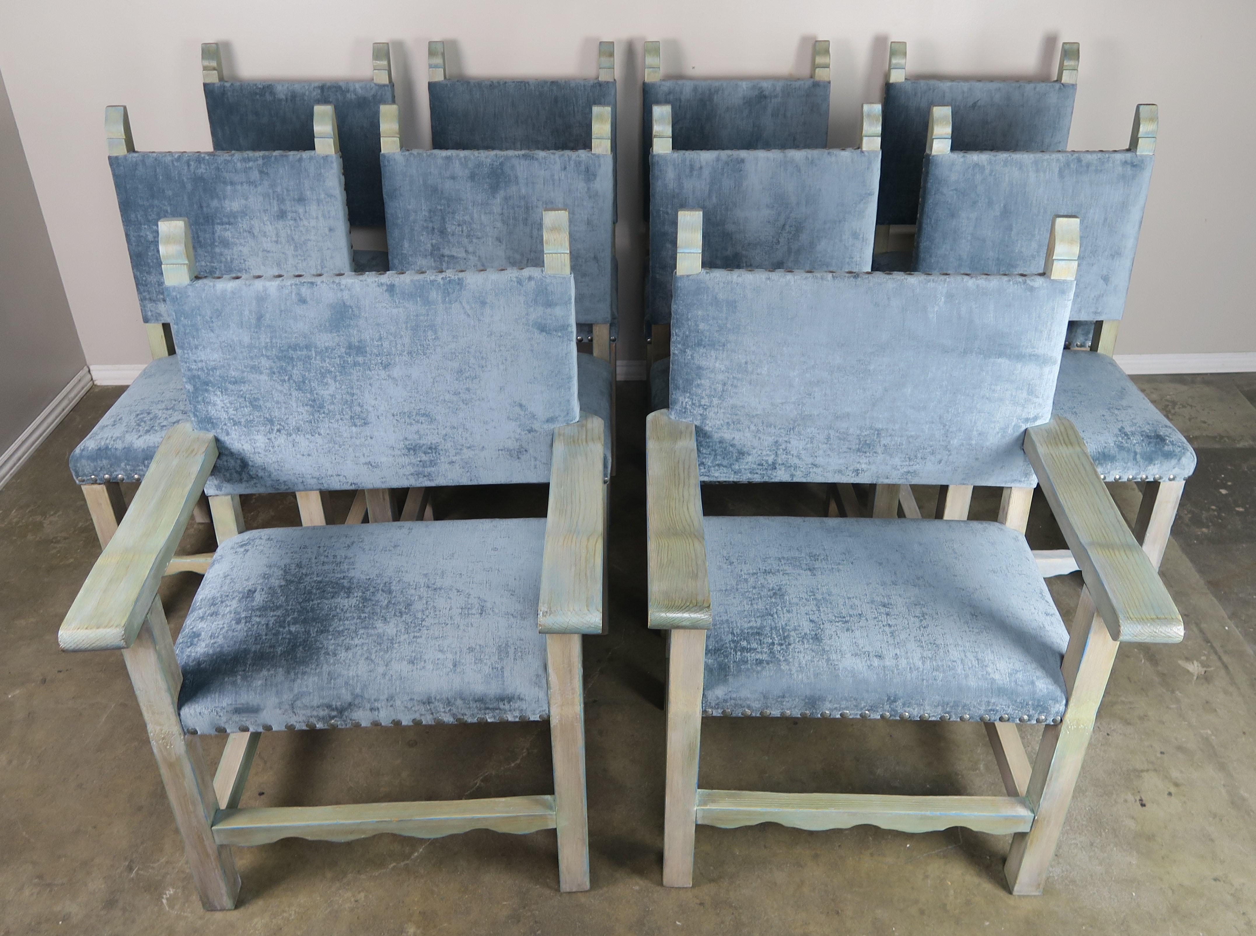 Set of (10) Spanish painted walnut dining chairs with aqua velvet upholstery and antique brass colored nailhead trim detail.
Measures: Armchairs 28 x 22 x 40 SH 19
Side chairs 19 x 19 x 40 SH 19.