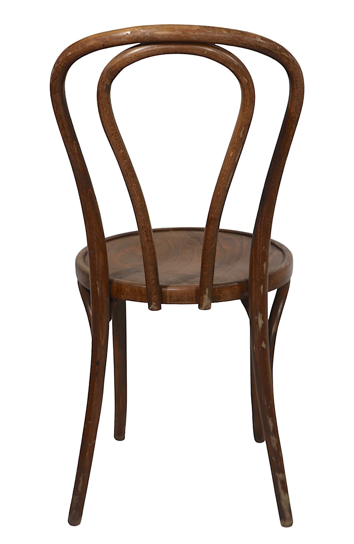 Set of ten Vienna Secessionist style cafe, bistro, dining chairs, made in Radomsko Poland ( Fameg SA )  circa 1950/70's. These classic chairs are in very good, clean, original ready to use condition, all show some cosmetic wear to their finish,
