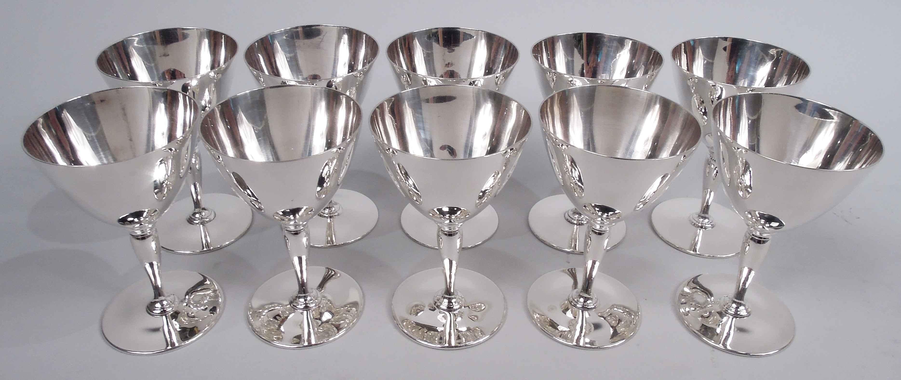 Set of 10 Art Deco sterling silver cocktail cups. Made by Tiffany & Co. in New York, ca 1915. Each: Cone on baluster mounted to round foot. Spare and functional. Nice balance for swishing the booze around. Fully marked including maker’s stamp,