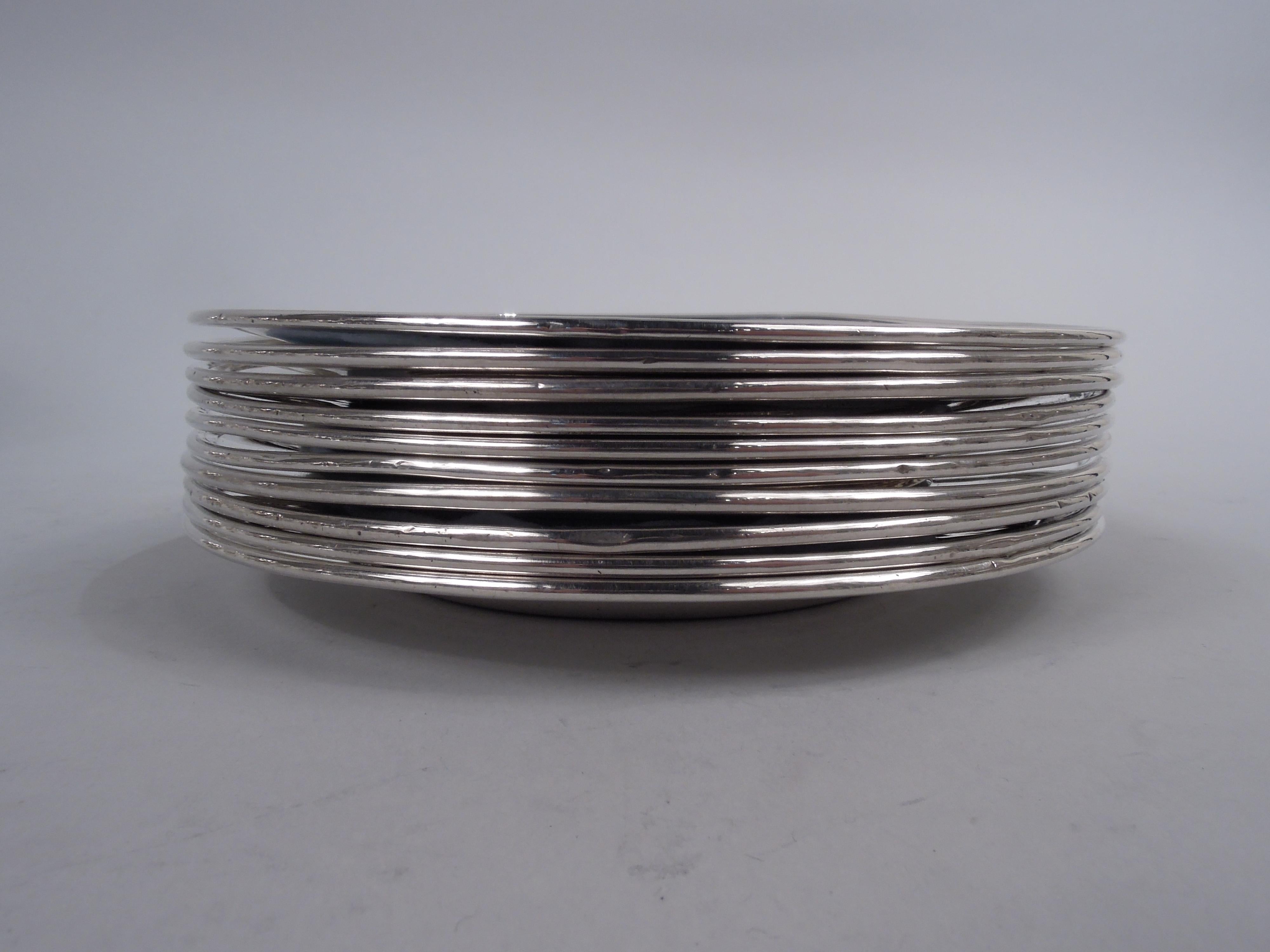 Set of 10 Modern sterling silver bread and butter plates. Made by Tiffany & Co. in New York, ca 1912. Each: Round and deep well, wide tapering shoulder, and molded rim. Fully marked including maker’s stamp, pattern no. 18249 (first produced in